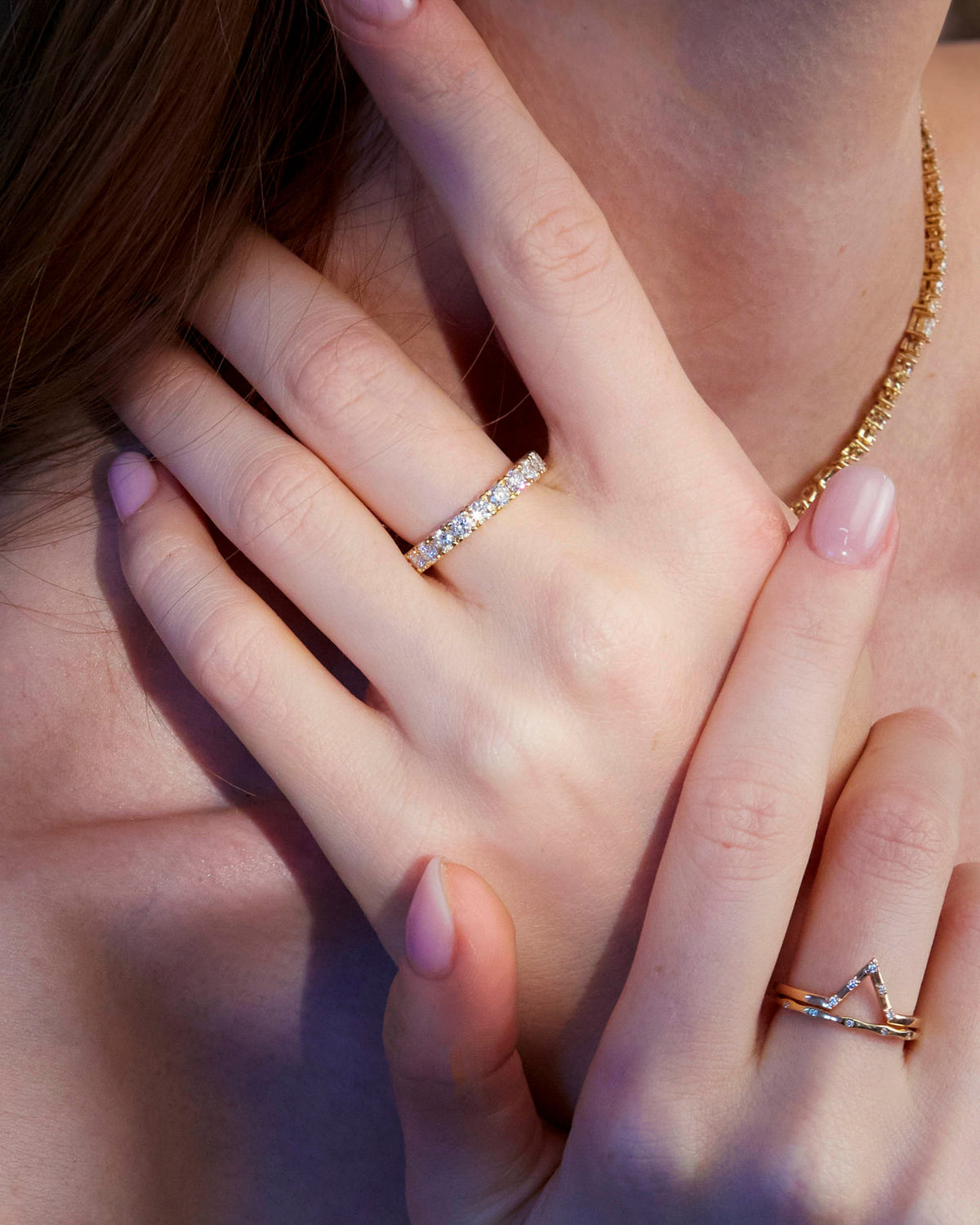 An Eternity Diamond Ring, Penta Diamond Band and Wave Diamond Band on beautiful model hands