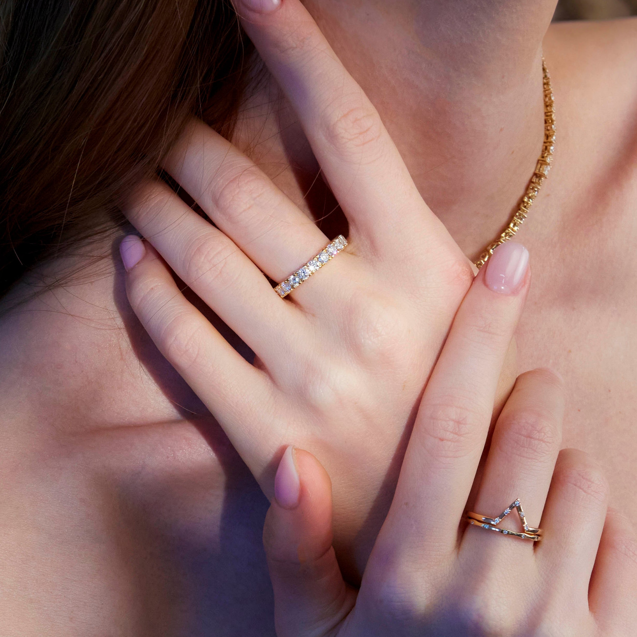 An Eternity Diamond Ring, Penta Diamond Band and Wave Diamond Band on beautiful model hands