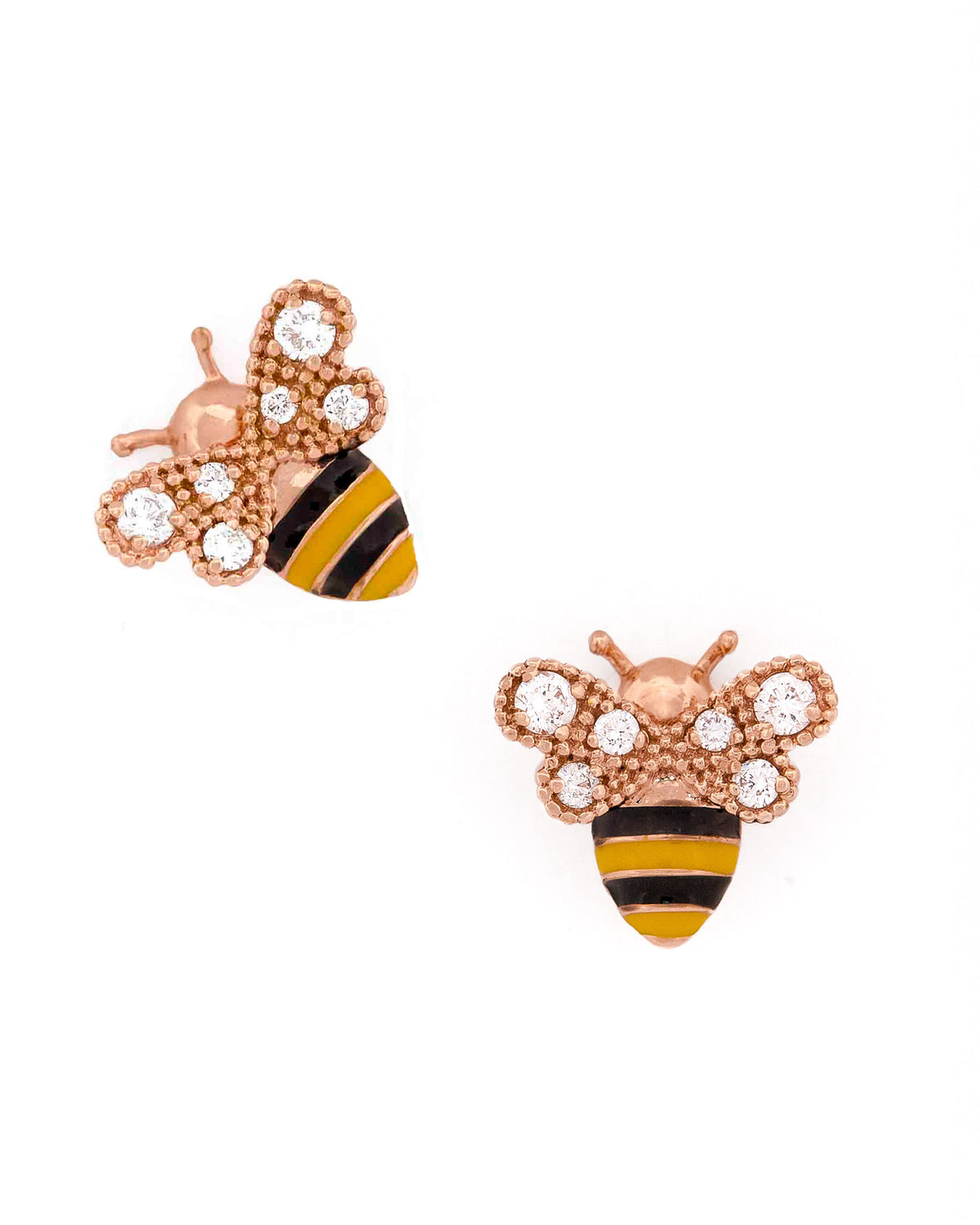 Gold bee-shaped earrings with black and yellow enamel and round diamonds on wings stripes on a white background