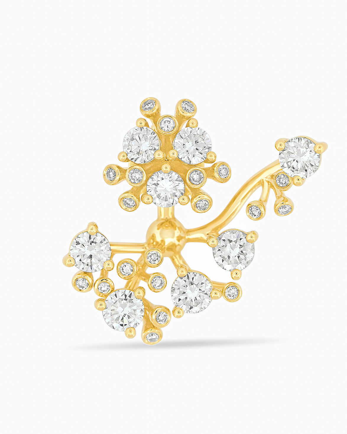 Gold and diamond bloom earring against a white background.