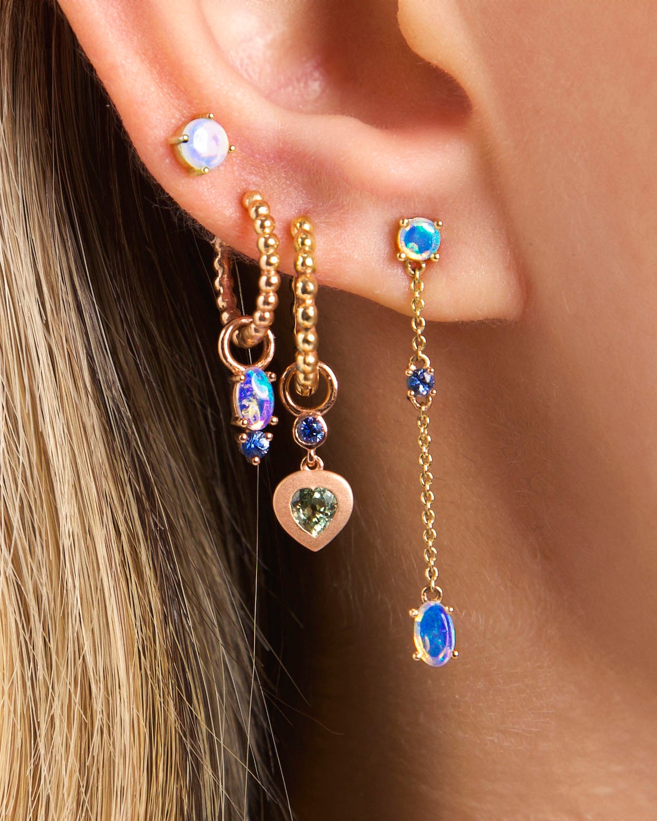 Earring combo on ear - Chain link Australian Opal earrings, The dot earrings, bubble time 13mm and 15mm hoops with Australian Opal and blue sapphire earrings accessories and Sweet love sapphire hearts earring accessories on ear. Combinatie de cercei pe ureche - Cercei chain link cu opale australiene, cercei the dot, cercei bubble times de 13mm si 15mm cu accesorii cu opale australiene si accesorii cu safire in forma de inimioara sweet love.