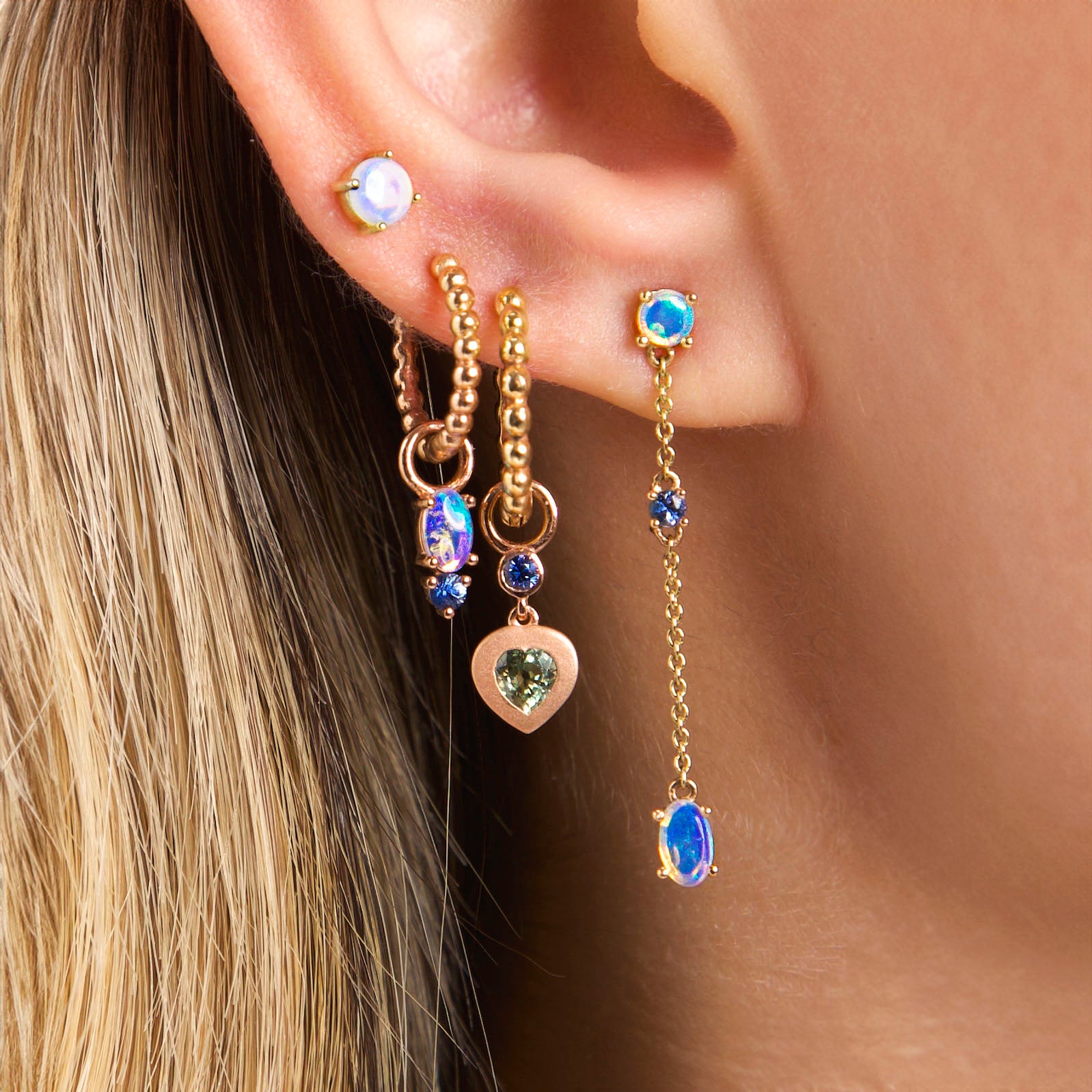 Earring combo on ear - Chain link Australian Opal earrings, The dot earrings, bubble time 13mm and 15mm hoops with Australian Opal and blue sapphire earrings accessories and Sweet love sapphire hearts earring accessories on ear. Combinatie de cercei pe ureche - Cercei chain link cu opale australiene, cercei the dot, cercei bubble times de 13mm si 15mm cu accesorii cu opale australiene si accesorii cu safire in forma de inimioara sweet love.