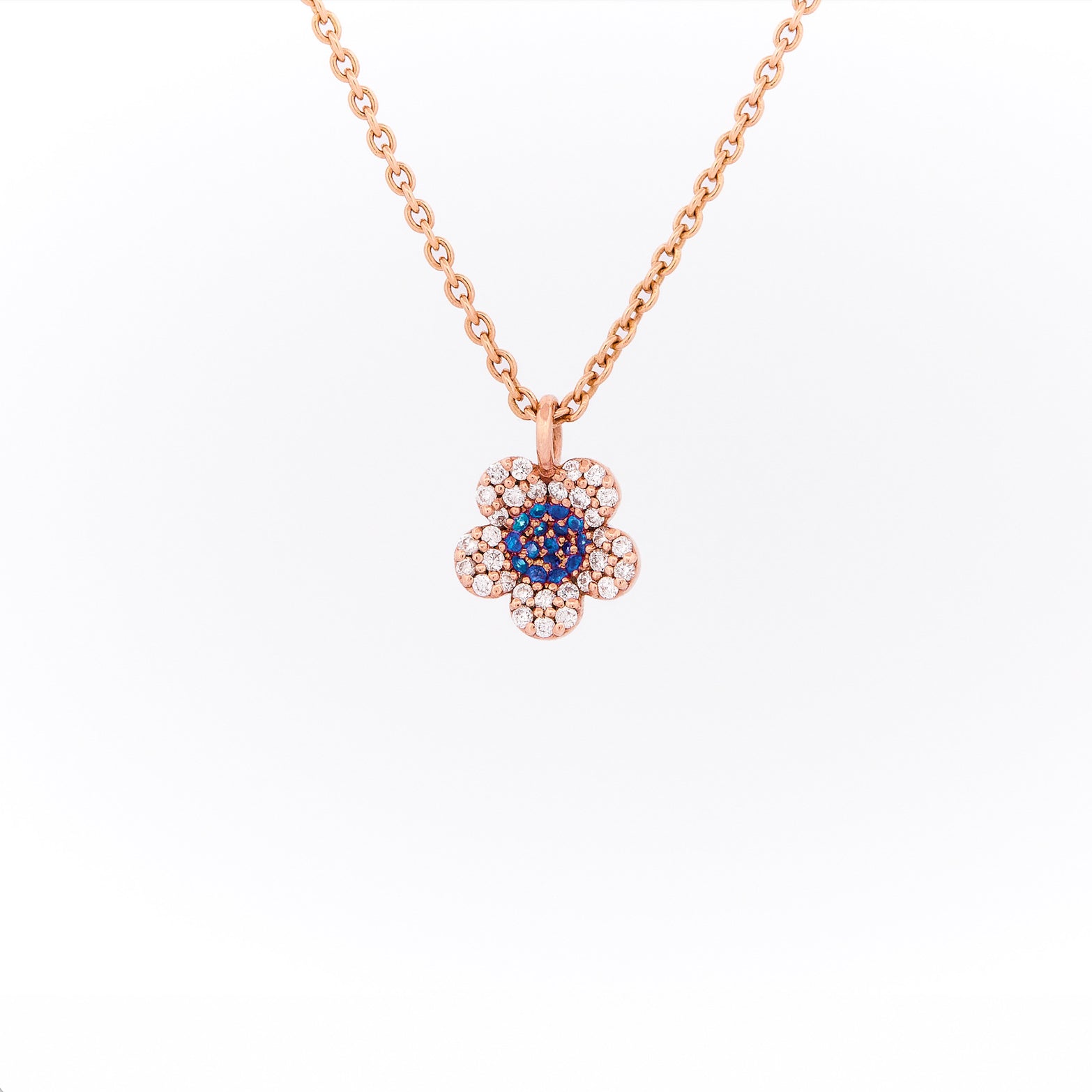 Rose gold necklace with a flower-shaped pendant on a white background