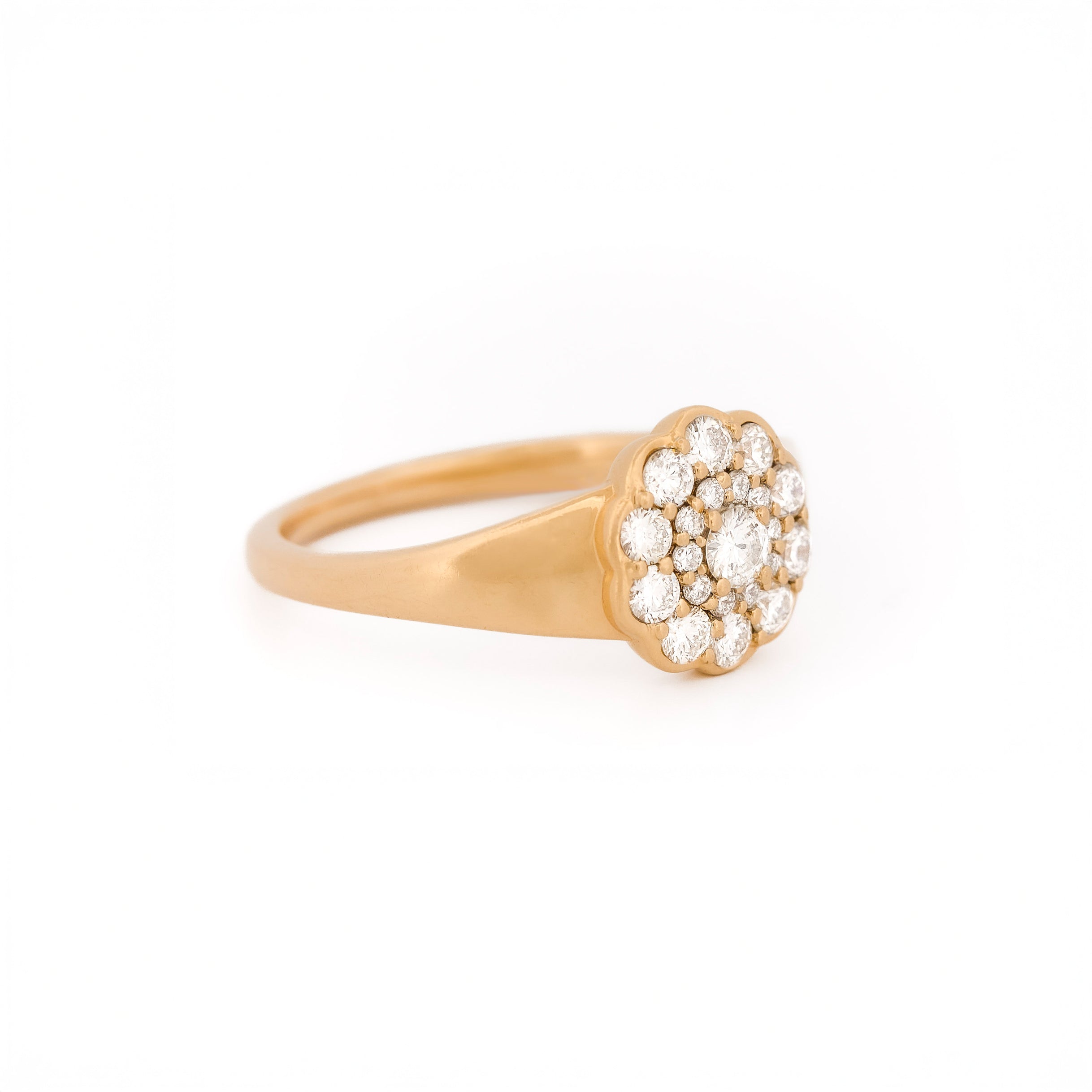 Yellow gold ring with diamond cluster daisy flower on a white background