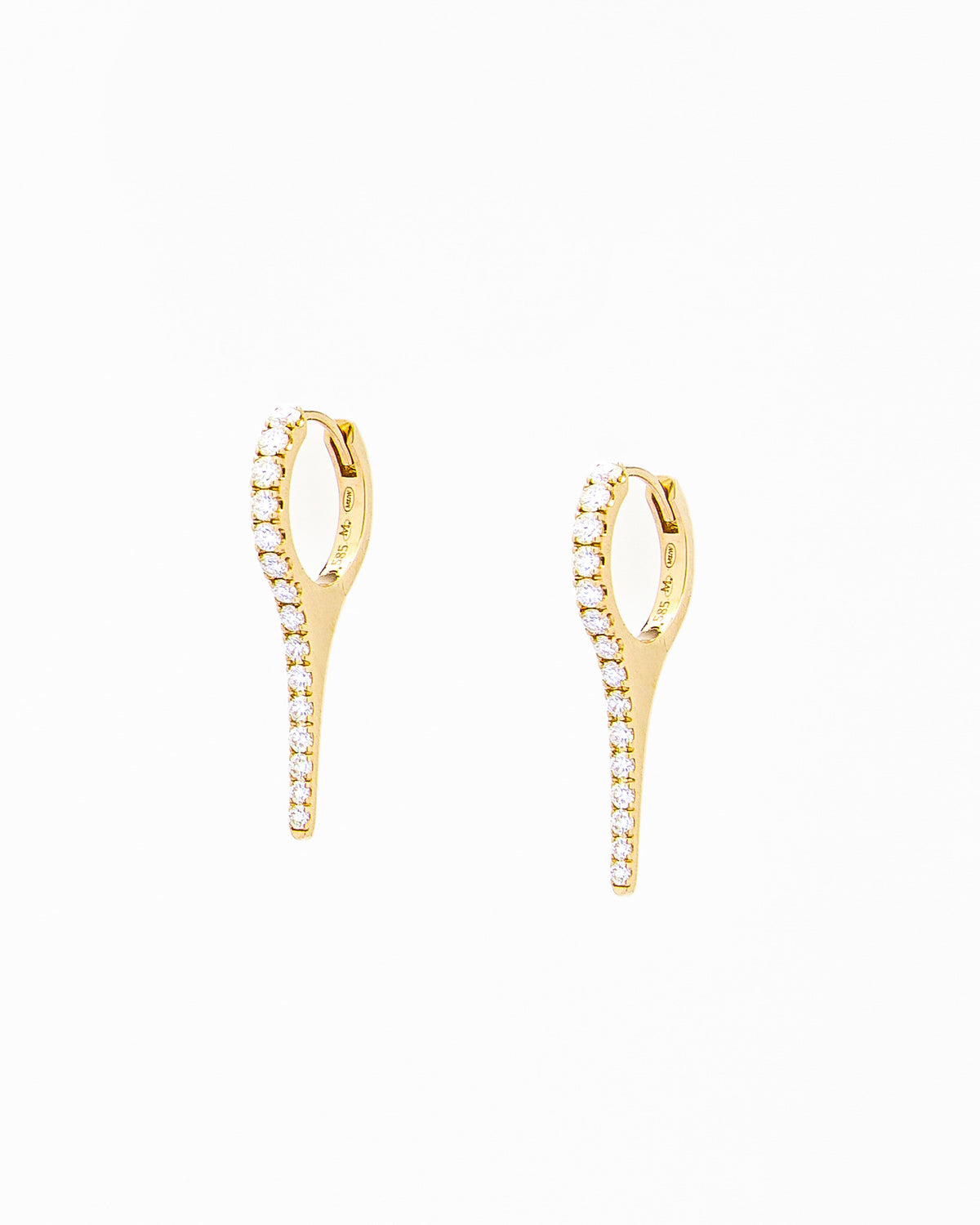 A pair of yellow gold earrings with natural diamond drops, featuring a minimalist design.