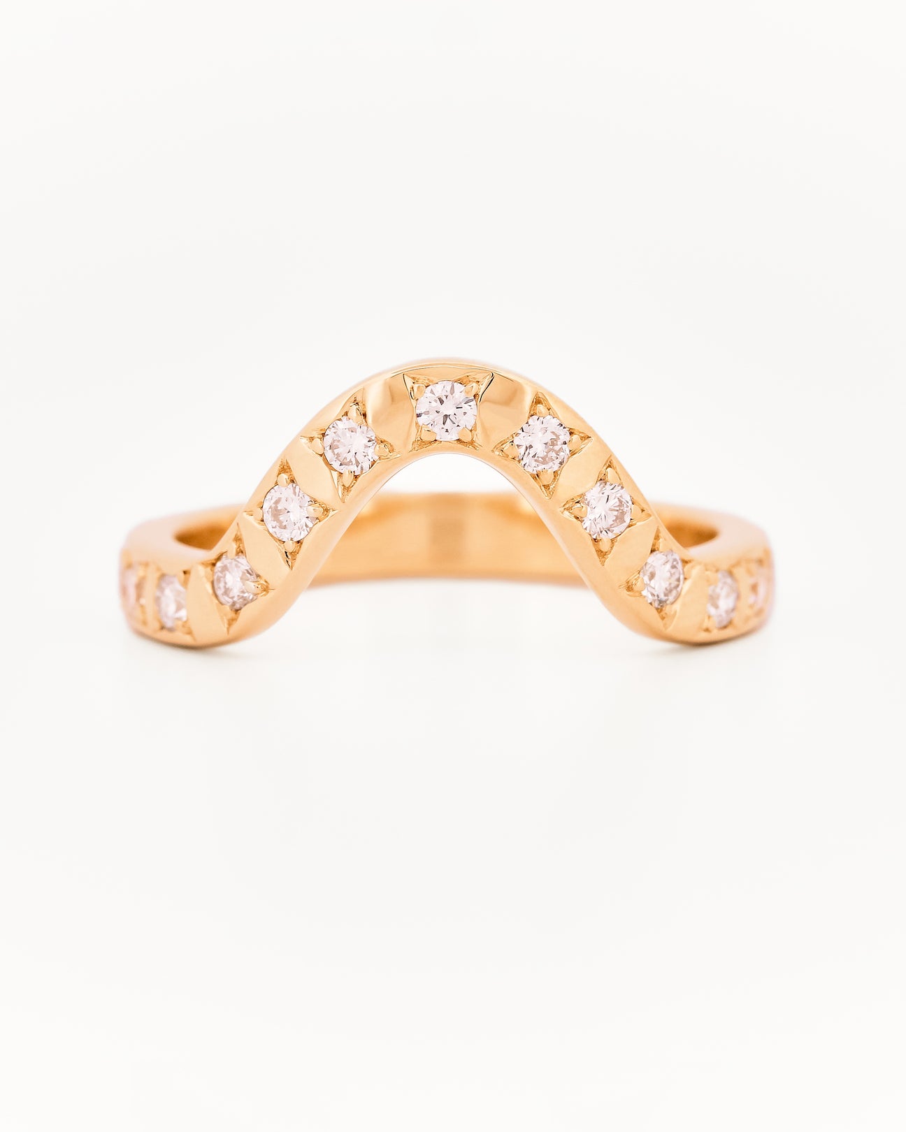 Yellow gold 2.5 mm band ring with 3 round diamondsdiamonds on a white background.