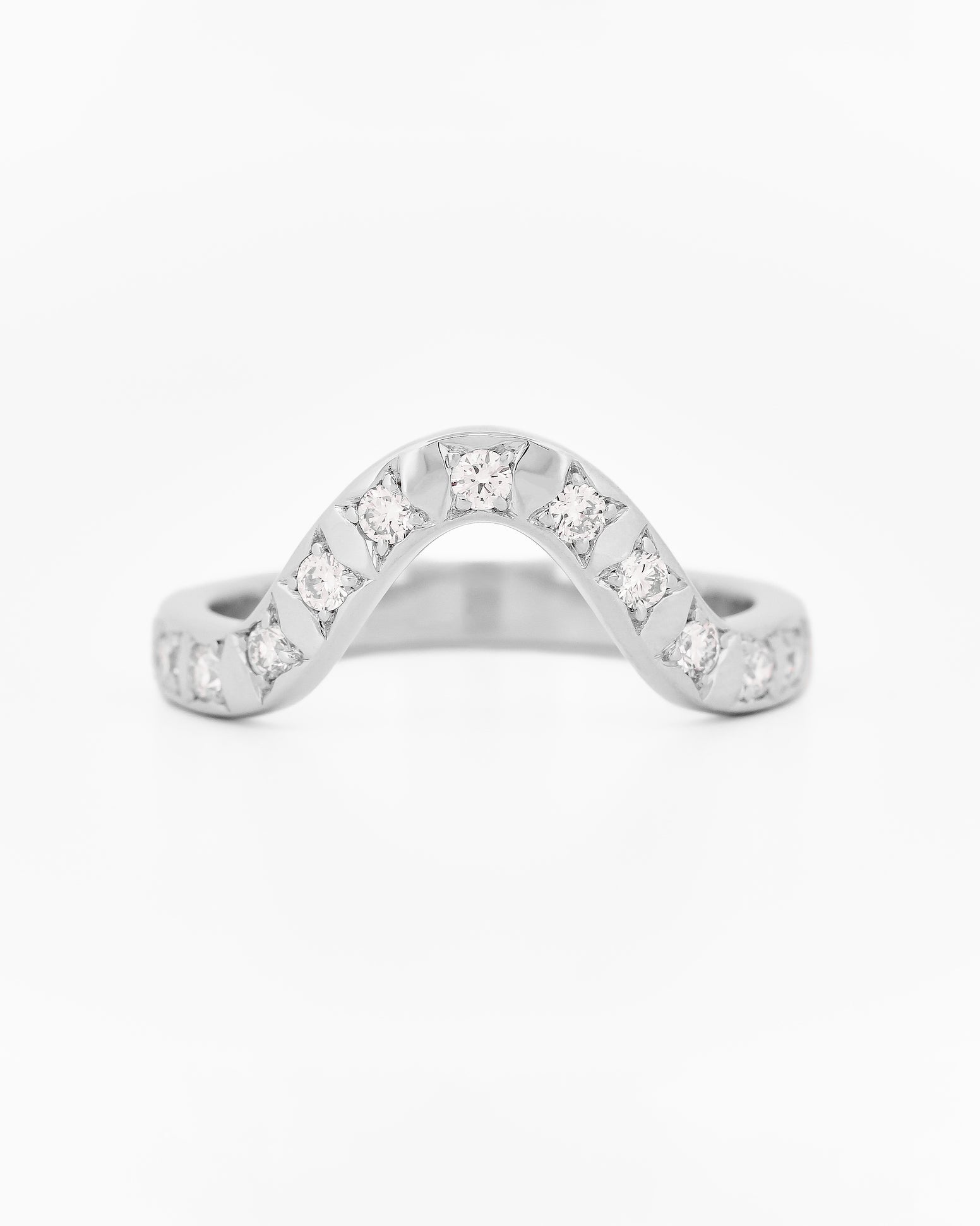 White gold 2.5 mm band ring with 3 round diamondsdiamonds on a white background.