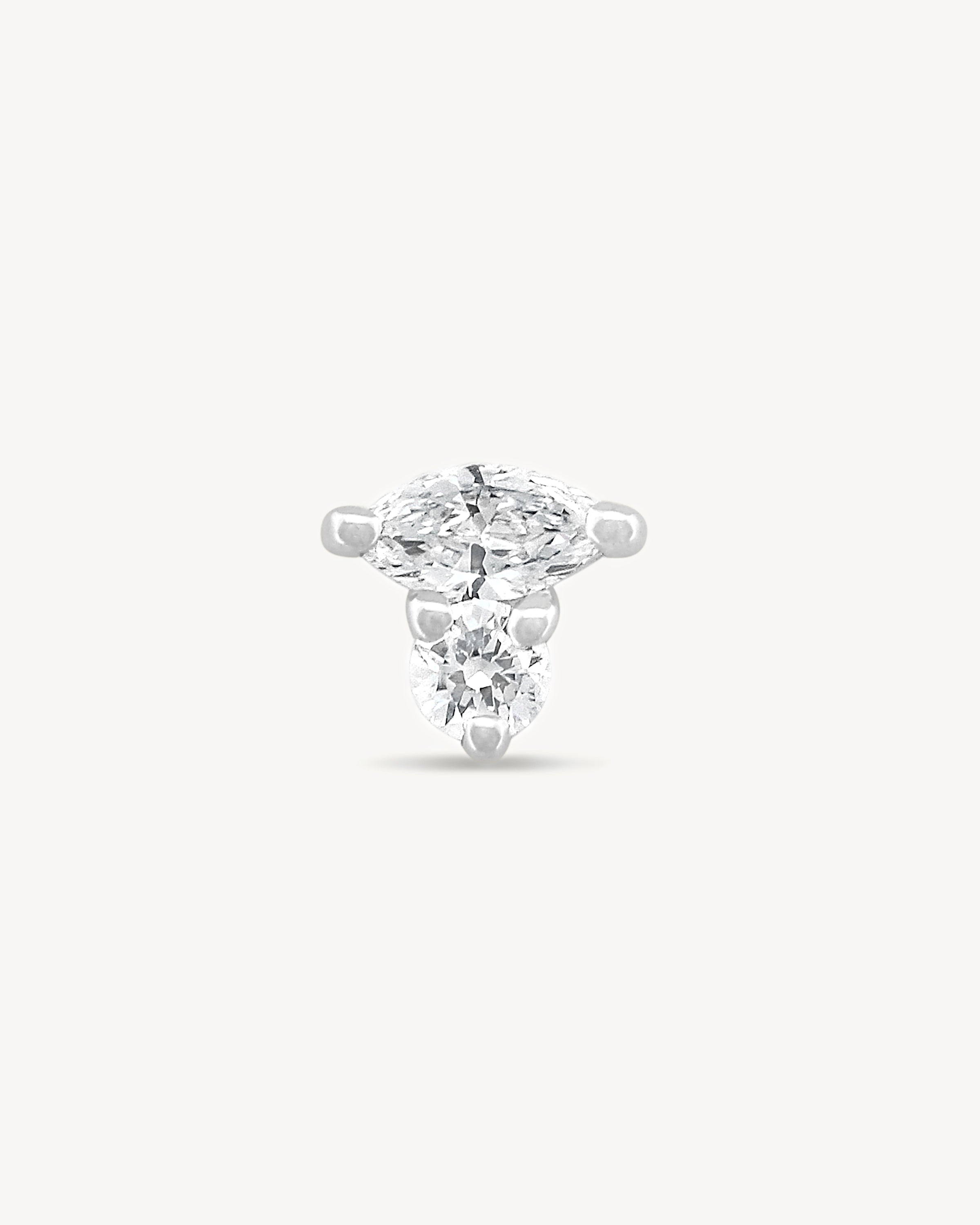 White gold Marquise and round Diamond stud earring with on a light gray background
