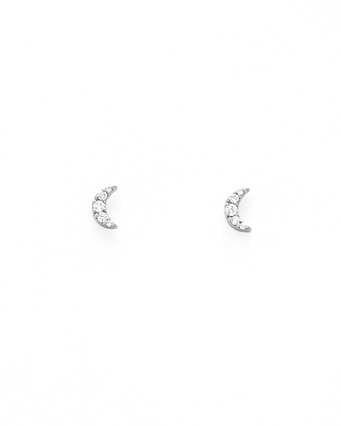 diamond stud earrings with a gold moon-shaped design.