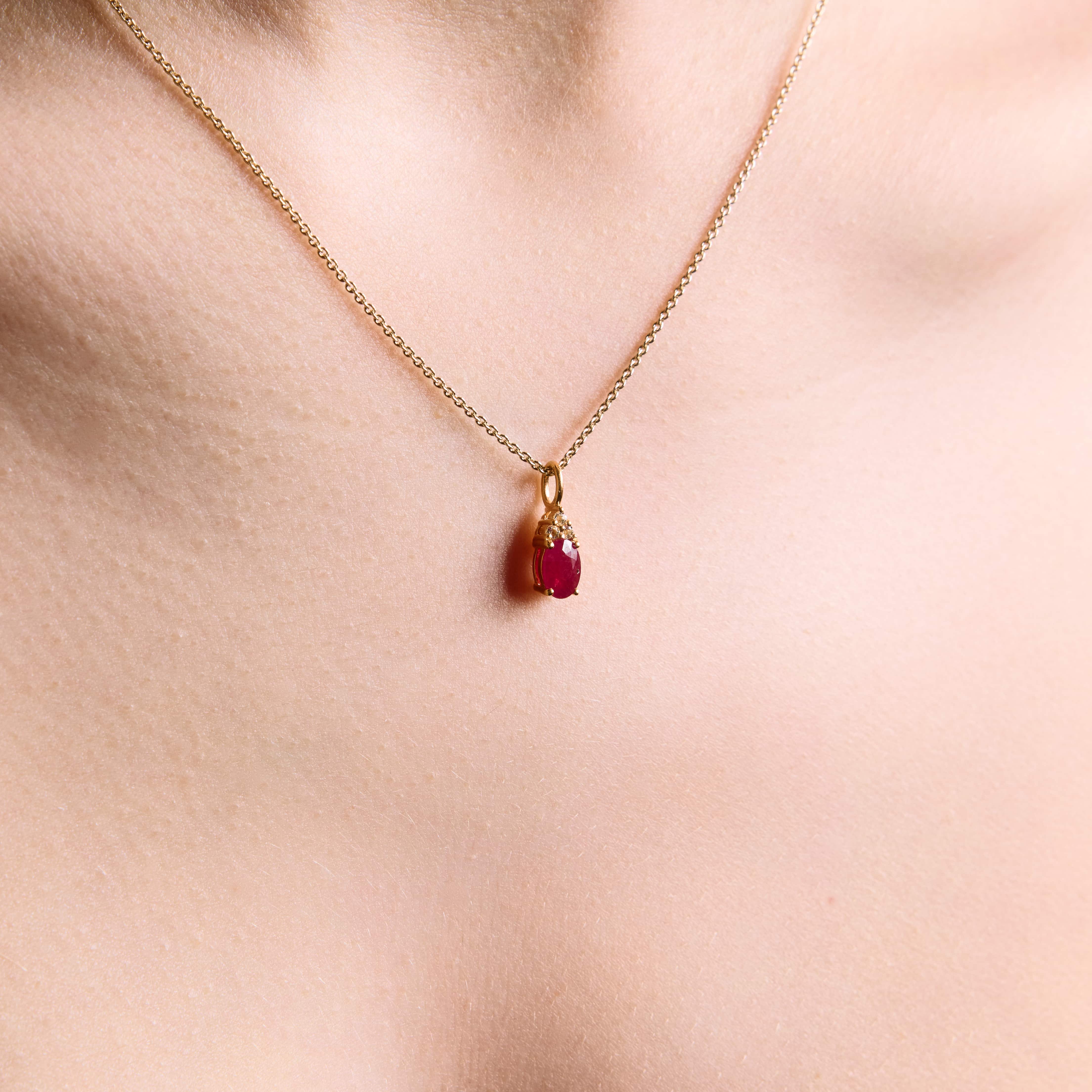 ruby pendant, ruby and diamonds pendant, ruby and diamonds pendant on chain, ruby, ruby and diamonds pendant in yellow gold on model