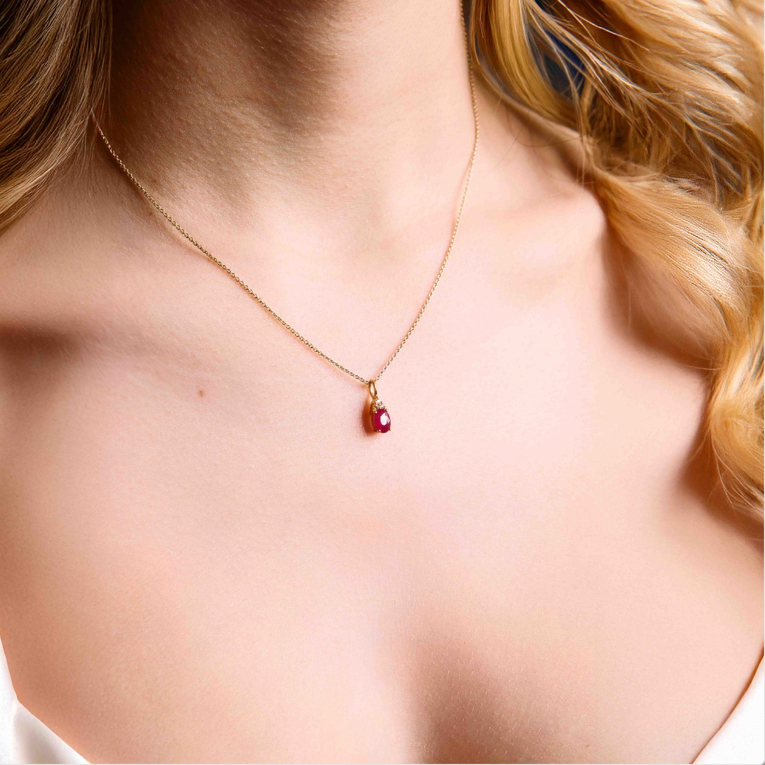 ruby pendant, ruby and diamonds pendant, ruby and diamonds pendant on chain, ruby, ruby and diamonds pendant in yellow gold on model