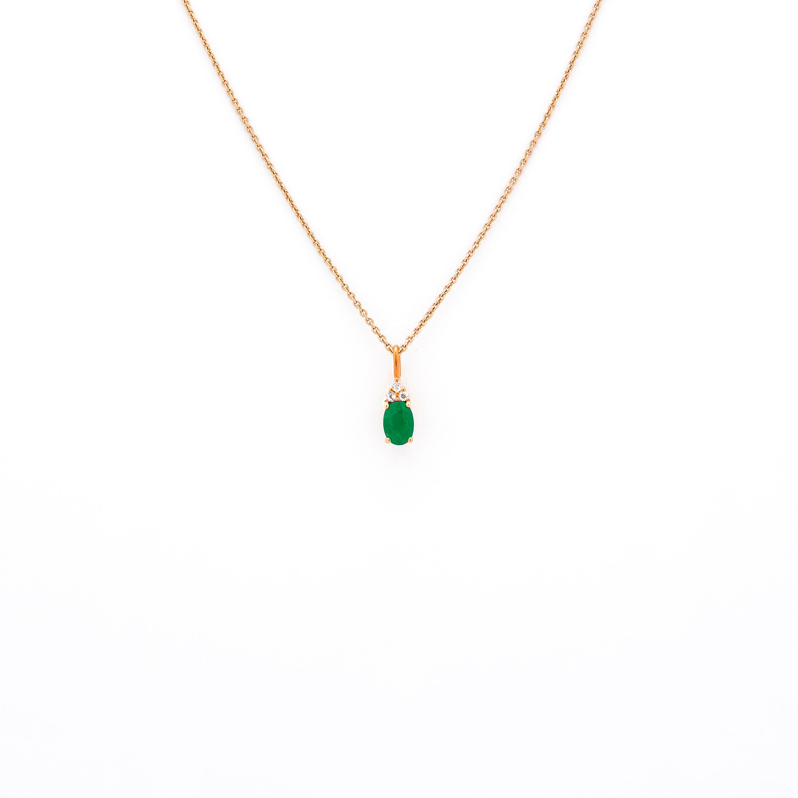 emerald pendant, emerald pendant with diamonds, emerald pendant on string chain, emerald pendant in rose gold.