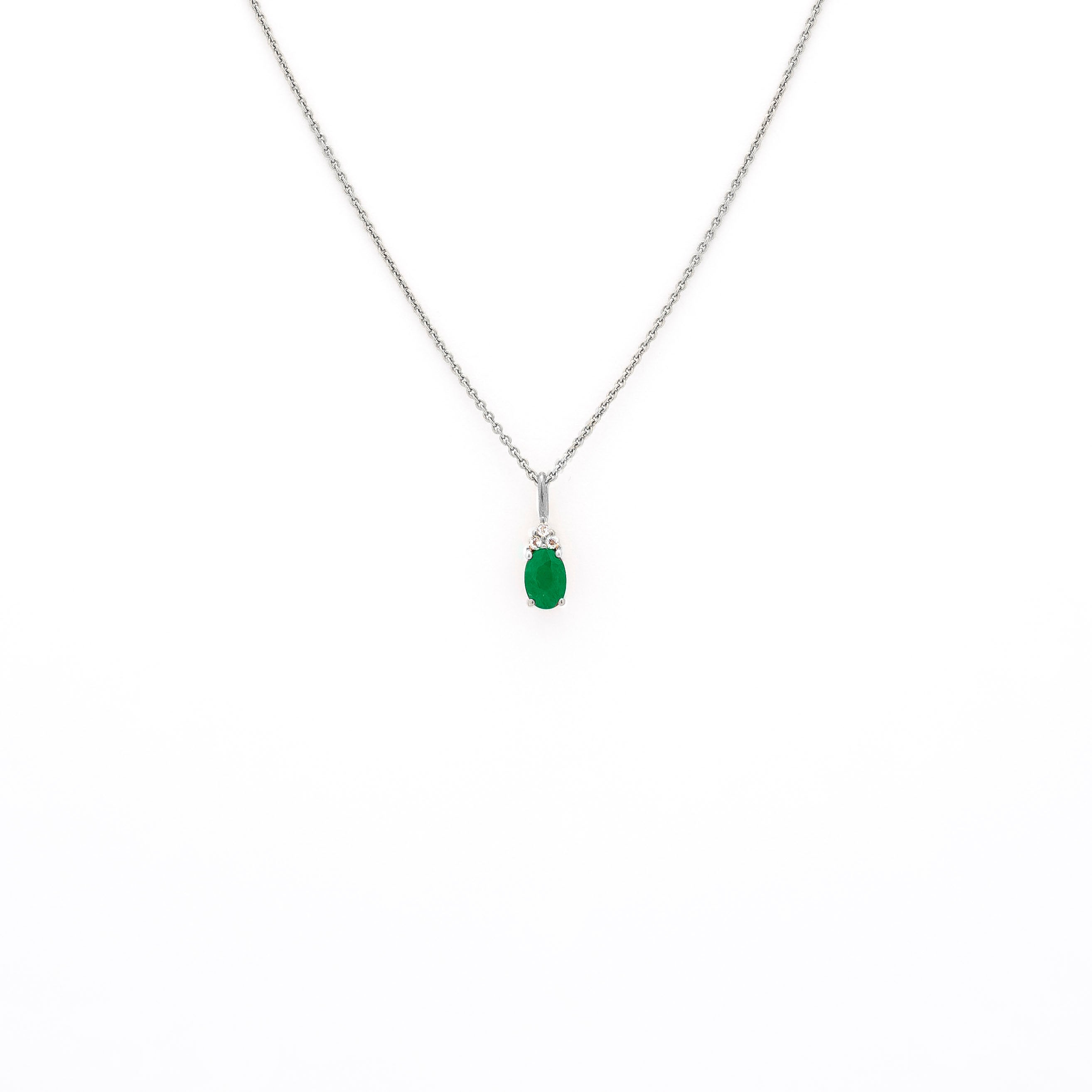 emerald pendant, emerald pendant with diamonds, emerald pendant on string chain, emerald pendant in white gold.