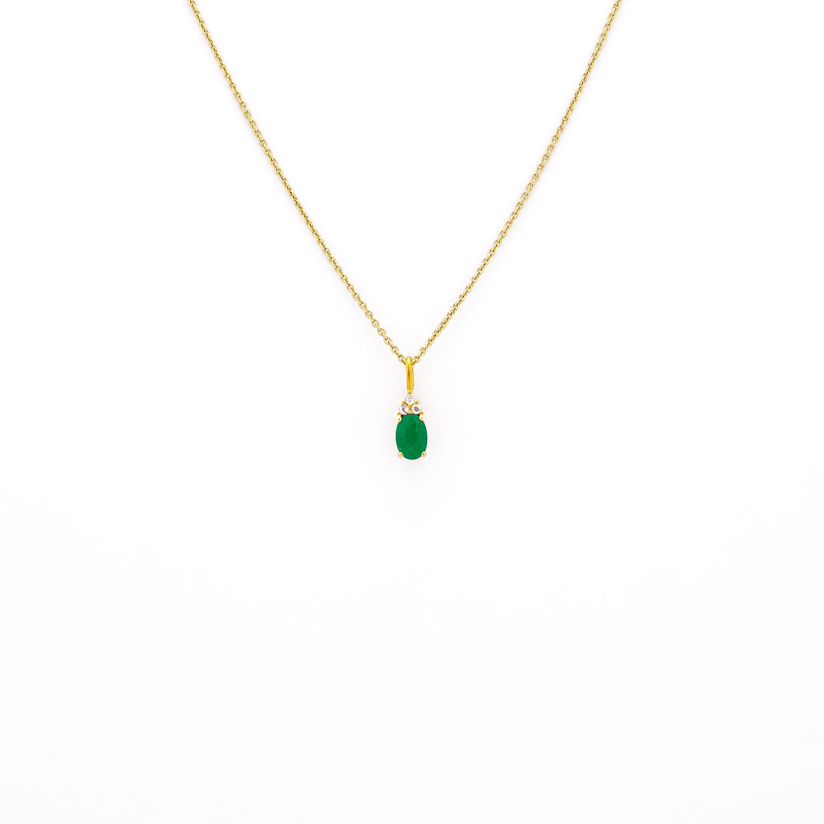 emerald pendant, emerald pendant with diamonds, emerald pendant on string chain, emerald pendant in yellow gold.