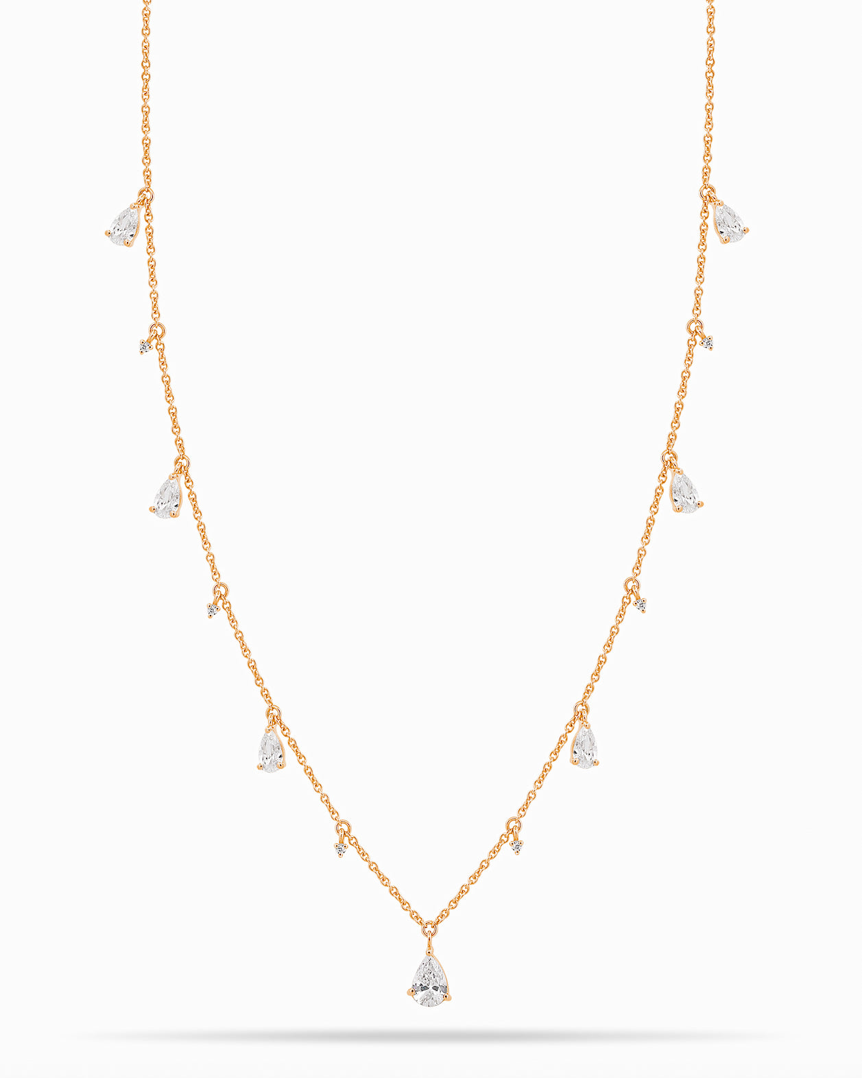 Rose Gold necklace with teardrop and round diamond pendants on a white background
