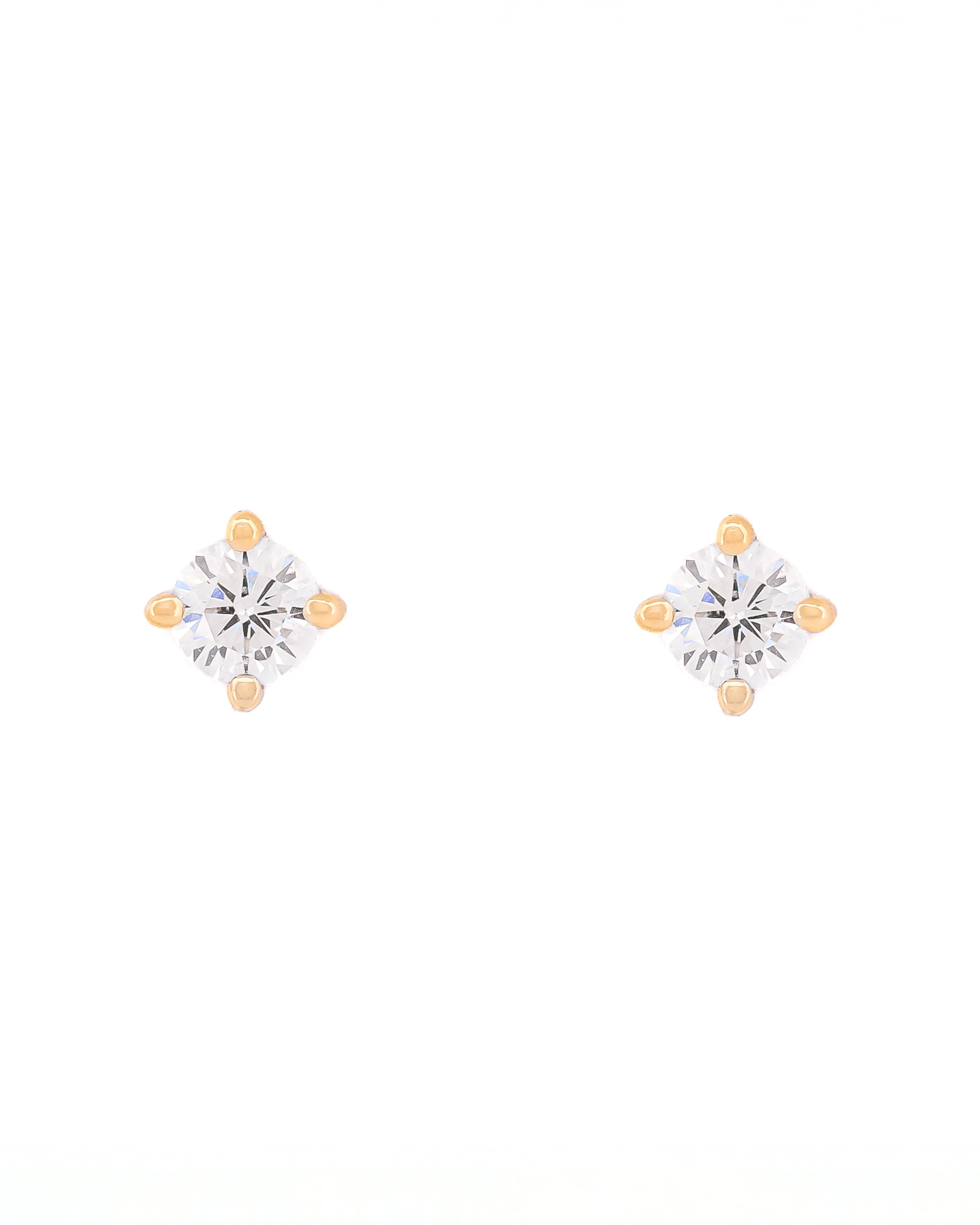 Pair of diamond stud earrings on a white background