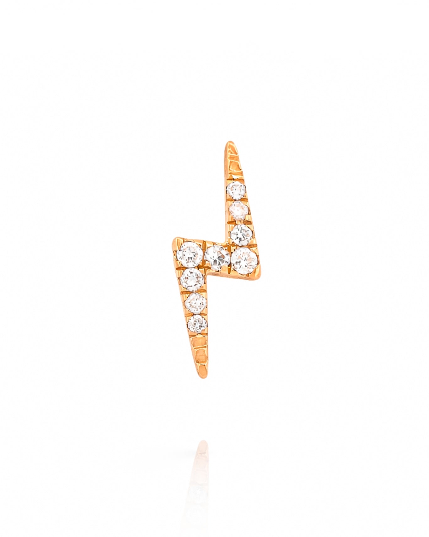 Rose gold lightning bolt earring with diamonds on a white background