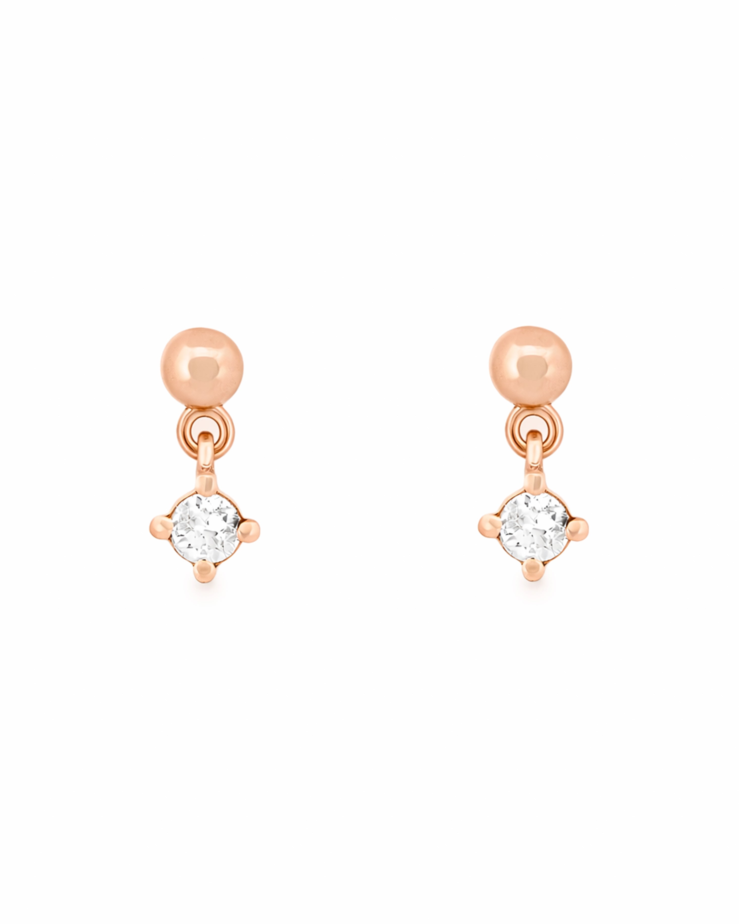 Rose gold earrings with round diamonds on a white background