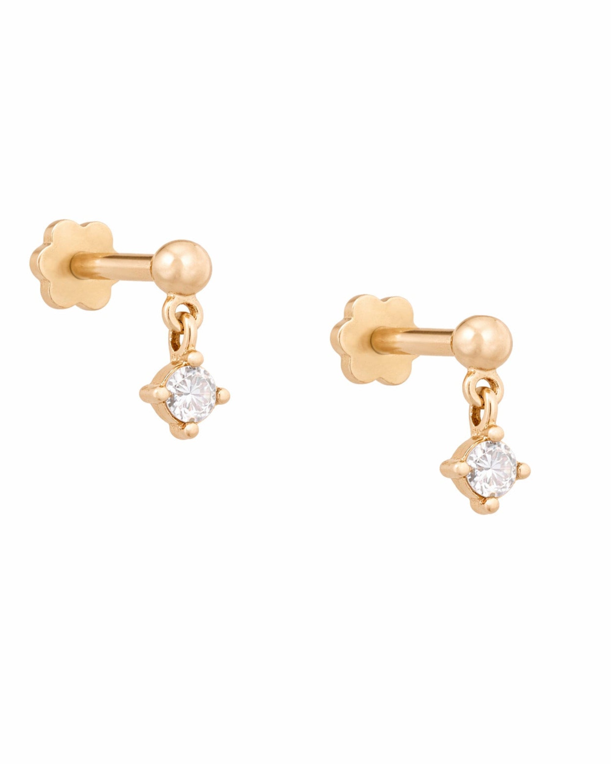 Yellow gold earrings with round diamonds on a white background