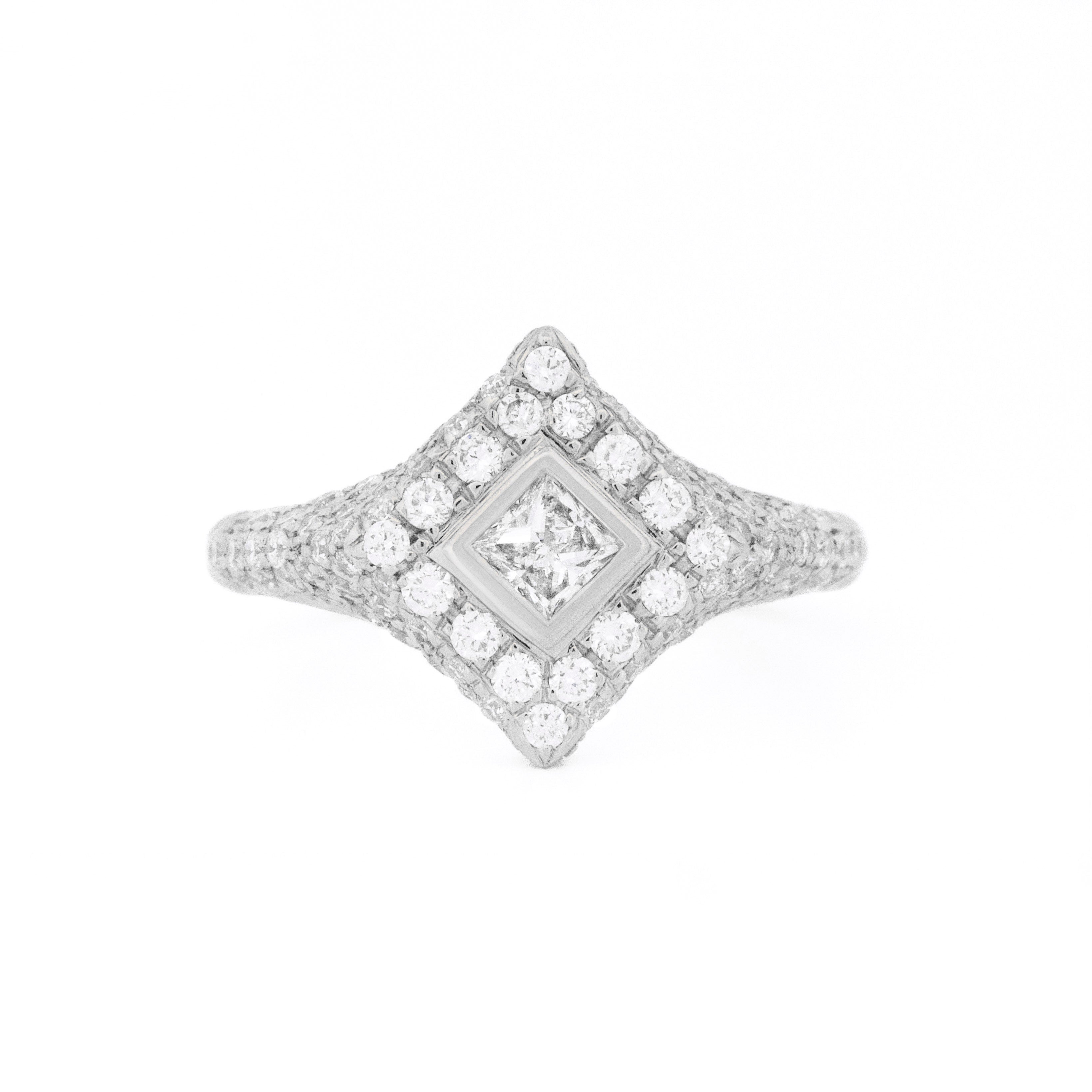 White gold ring with diamonds, rhombus and round shaped, on a white background