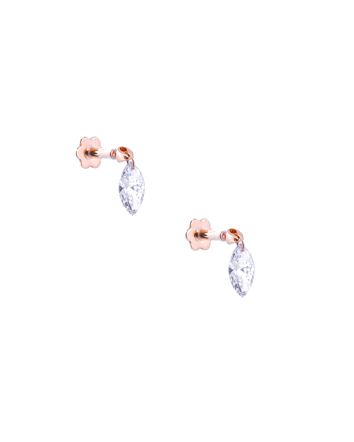 Pair of white gold earrings with floating diamonds on a white background