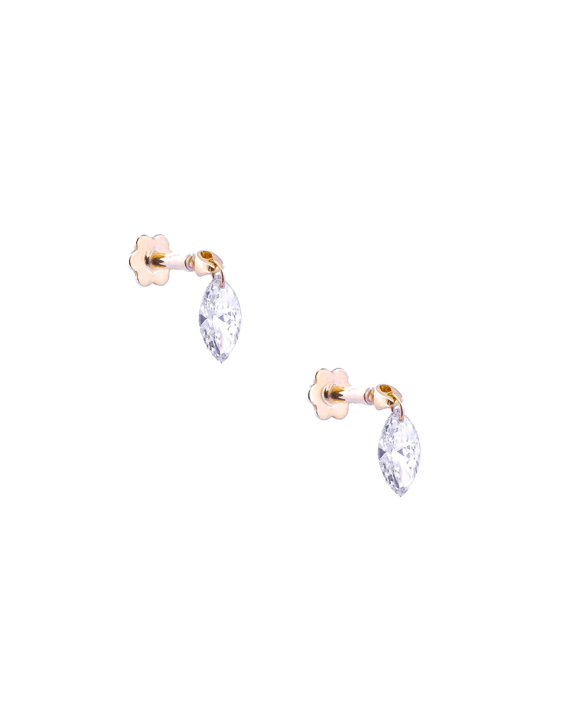 Pair of white gold earrings with floating diamonds on a white background