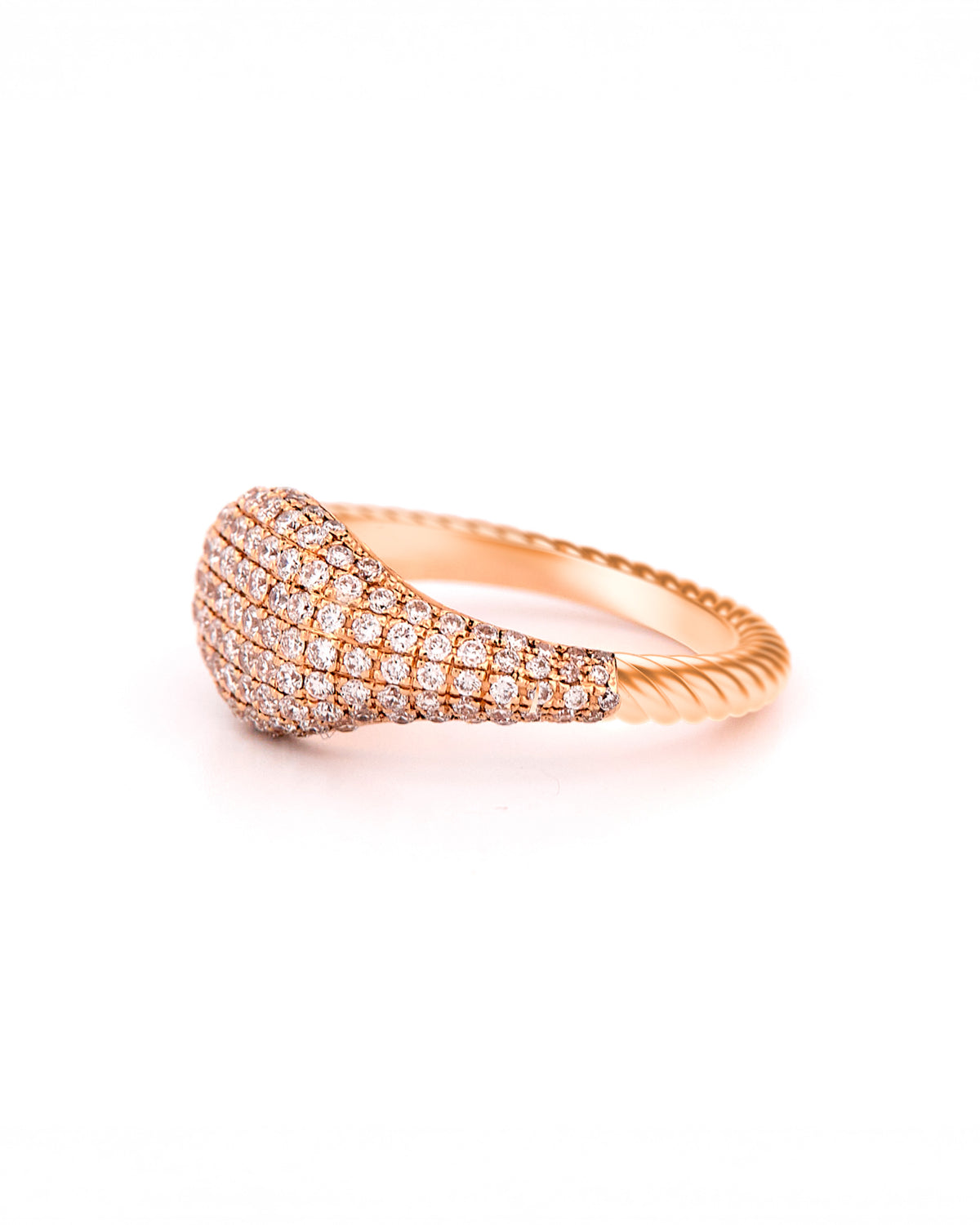 Gold ring with pave diamonds accents and a twisted gold band on a white background