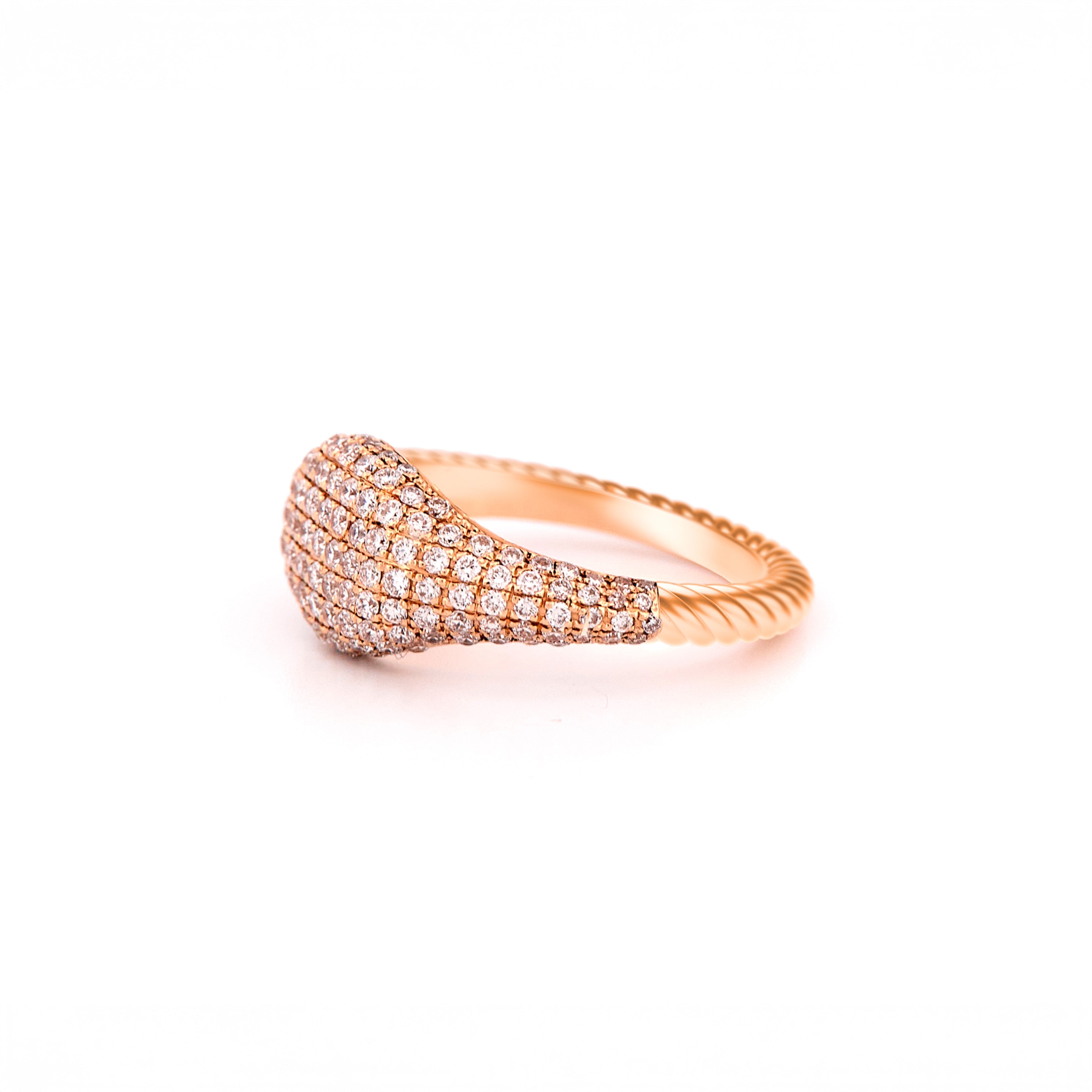 Gold ring with pave diamonds accents and a twisted gold band on a white background