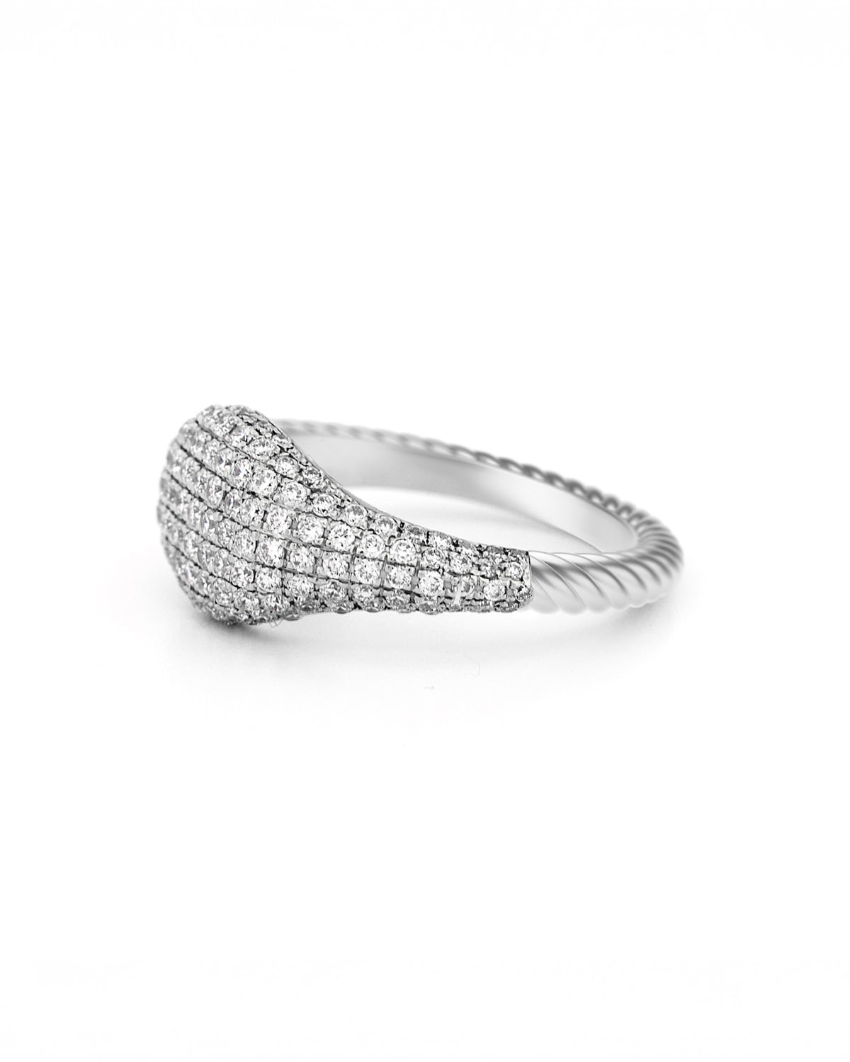 Gold ring with pave diamonds accents, with a twisted band on a white background