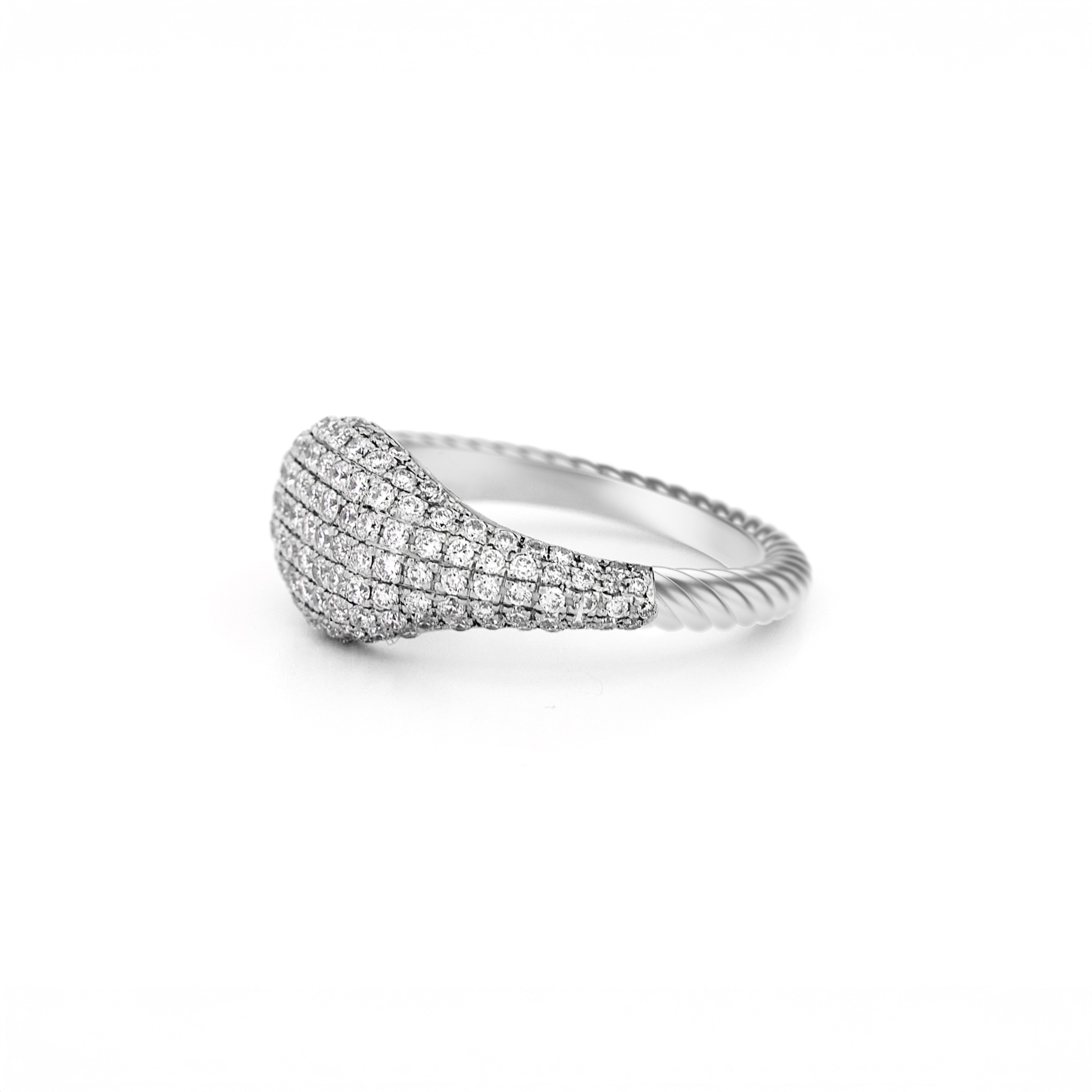 Gold ring with pave diamonds accents, with a twisted band on a white background
