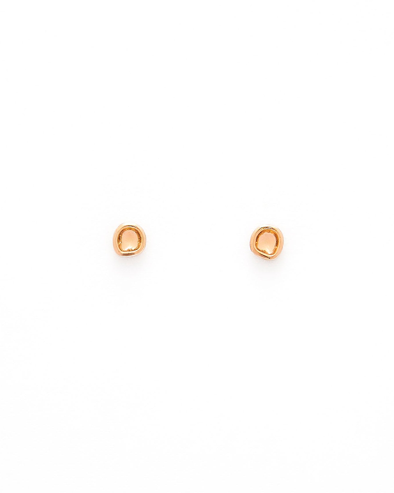 A pair of gold studs earrings with a simple design, resembling a prayer bowl or birds' nest, displayed against a white background.