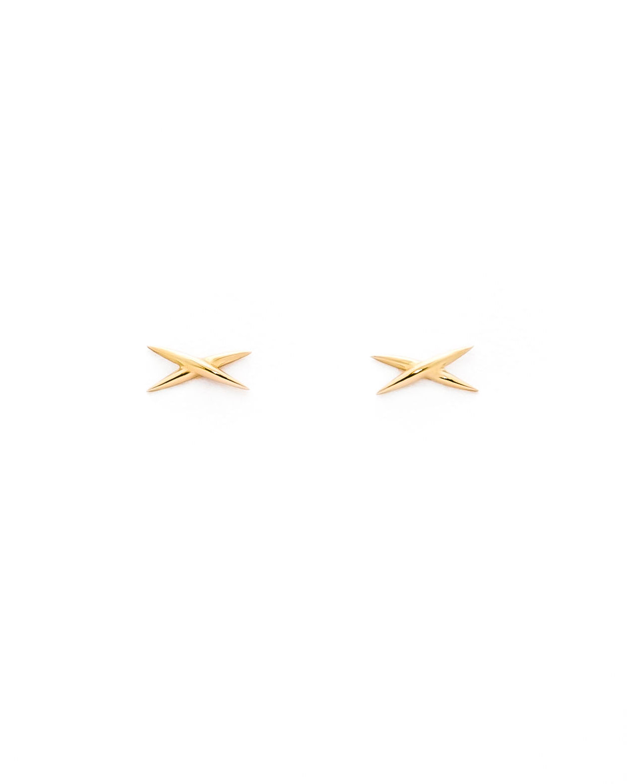 A pair of gold stud earrings shaped like an X on a white background.
