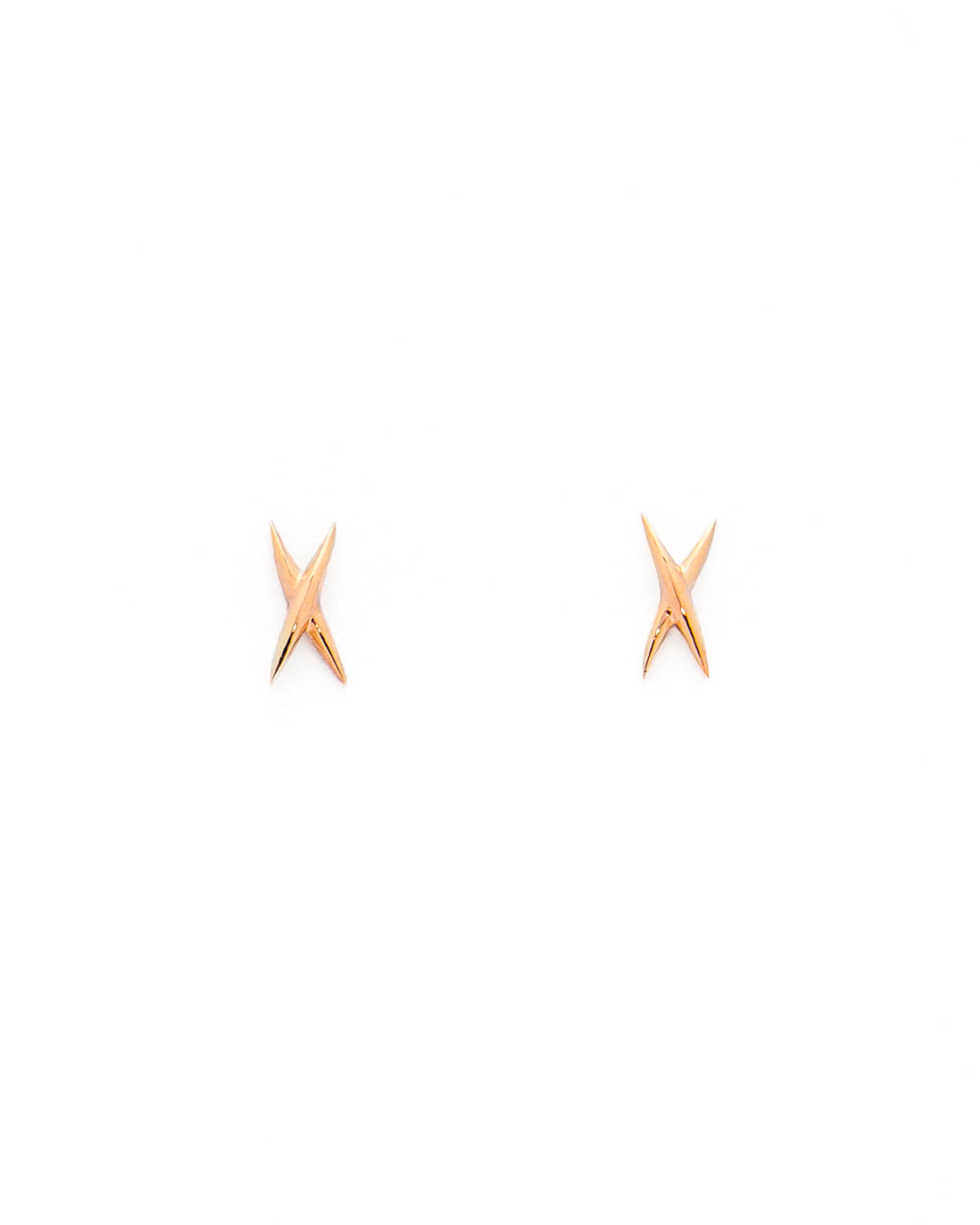 A pair of gold stud earrings shaped like an X on a white background.