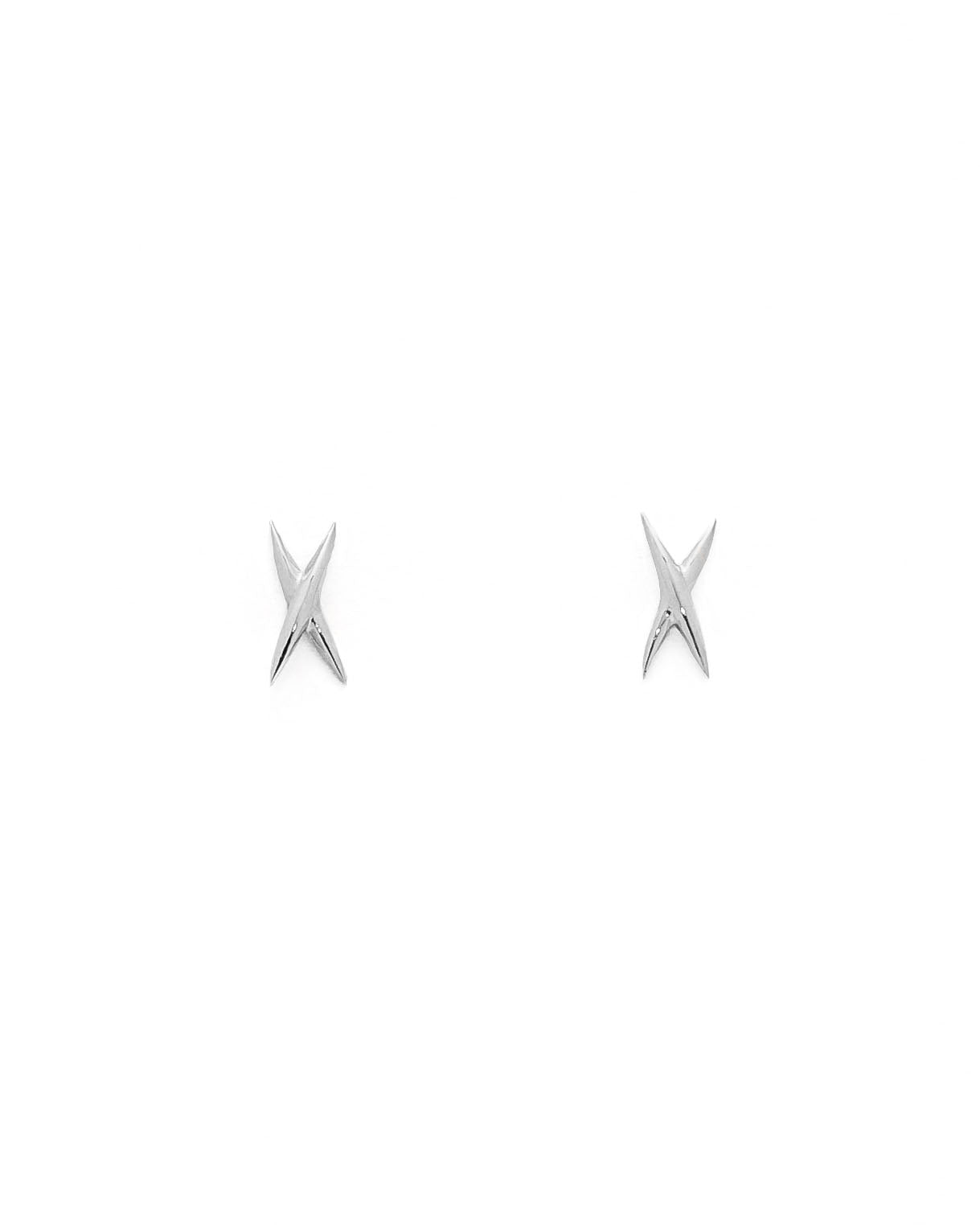 A pair of gold stud earrings shaped like an X on a white background.