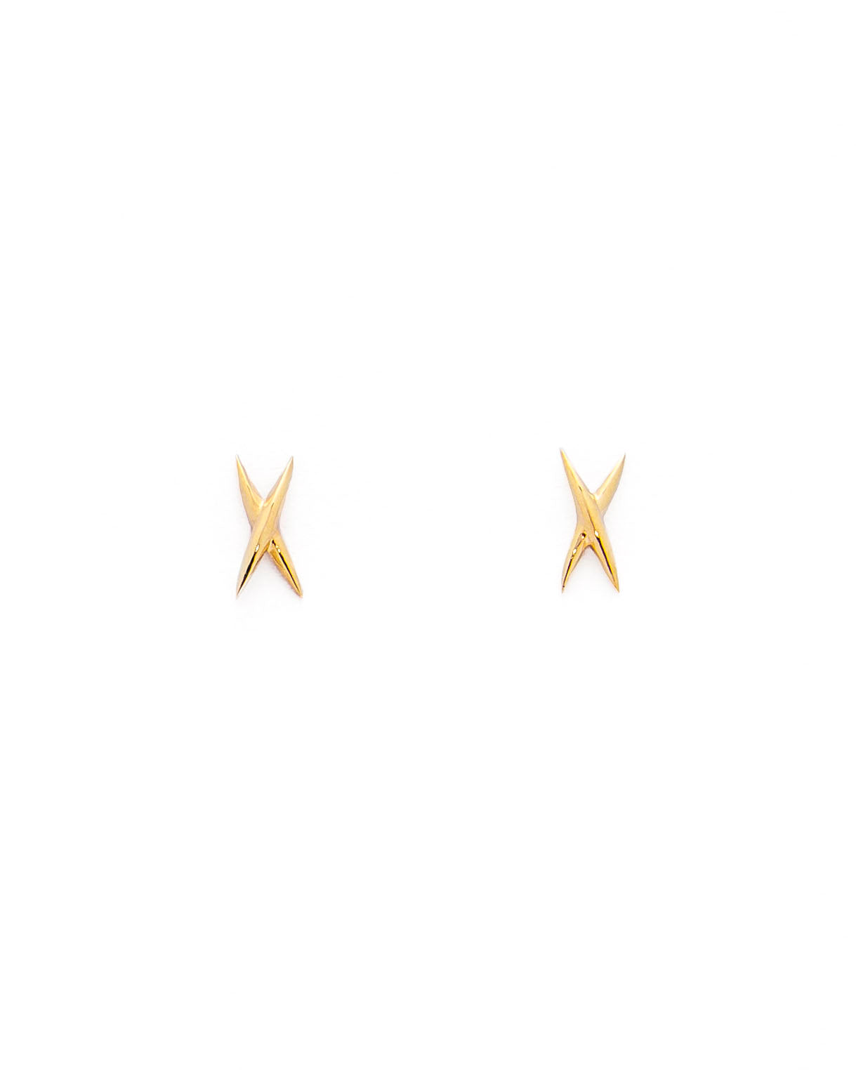 A pair of gold stud earrings shaped like an X on a white background.