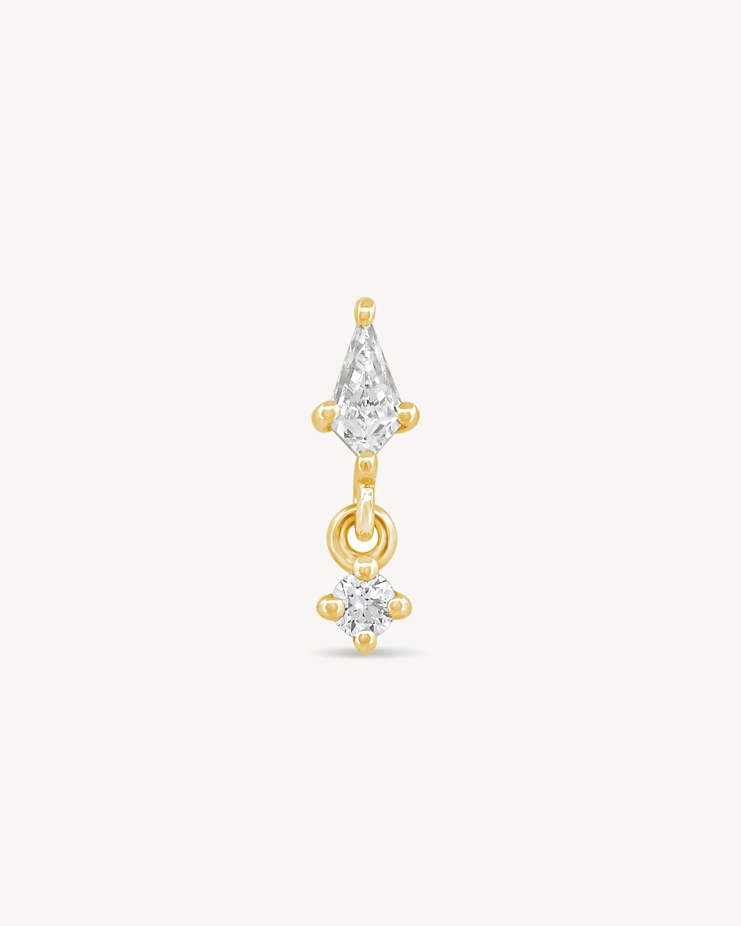 Kite and round diamonds stud earring with yellow gold on a light gray background