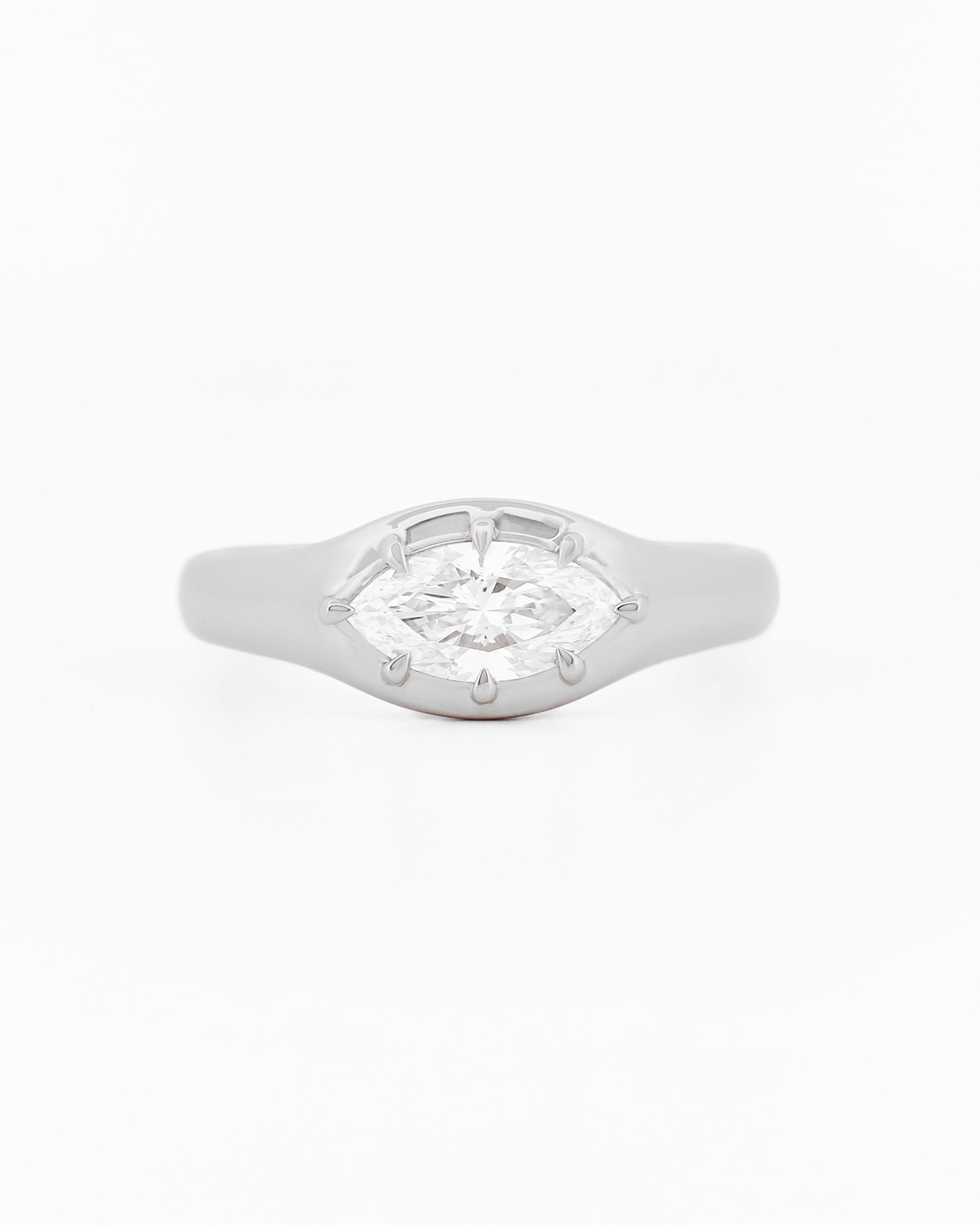 Signet Pinky Diamond ring, in white gold, on a with a white background
