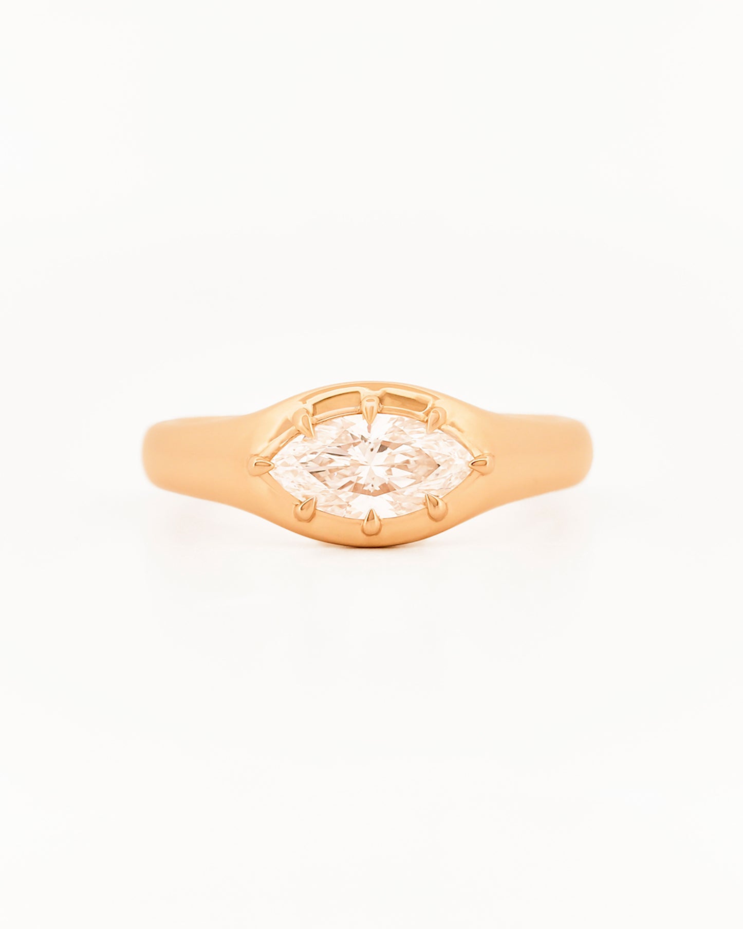 Signet Pinky Diamond ring, in yellow gold, on a with a white background