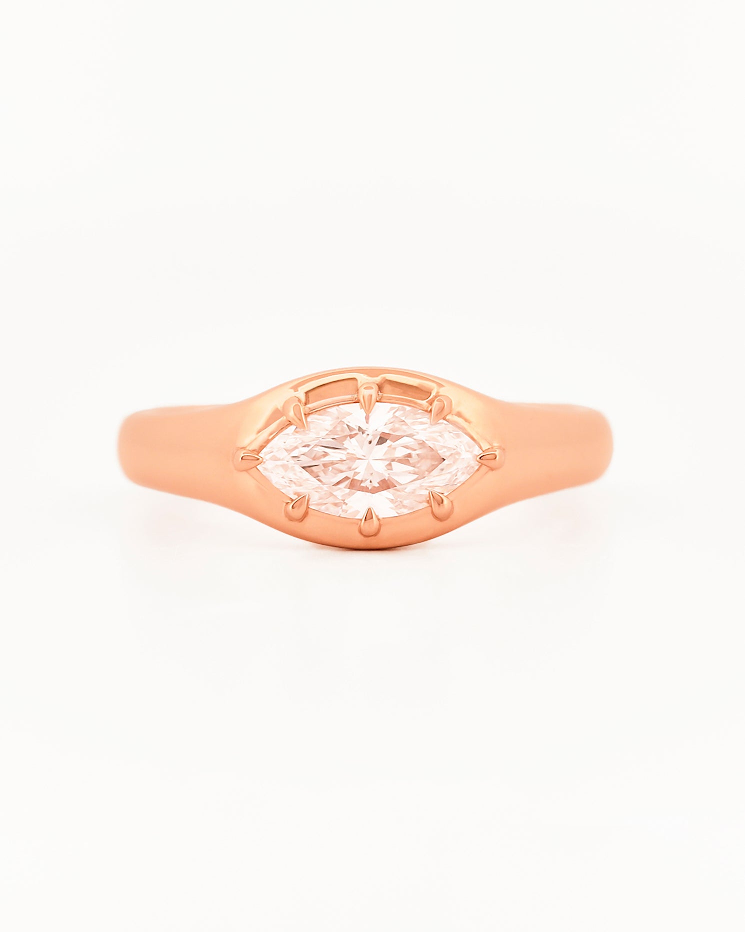 Signet Pinky Diamond ring, in rose gold, on a with a white background