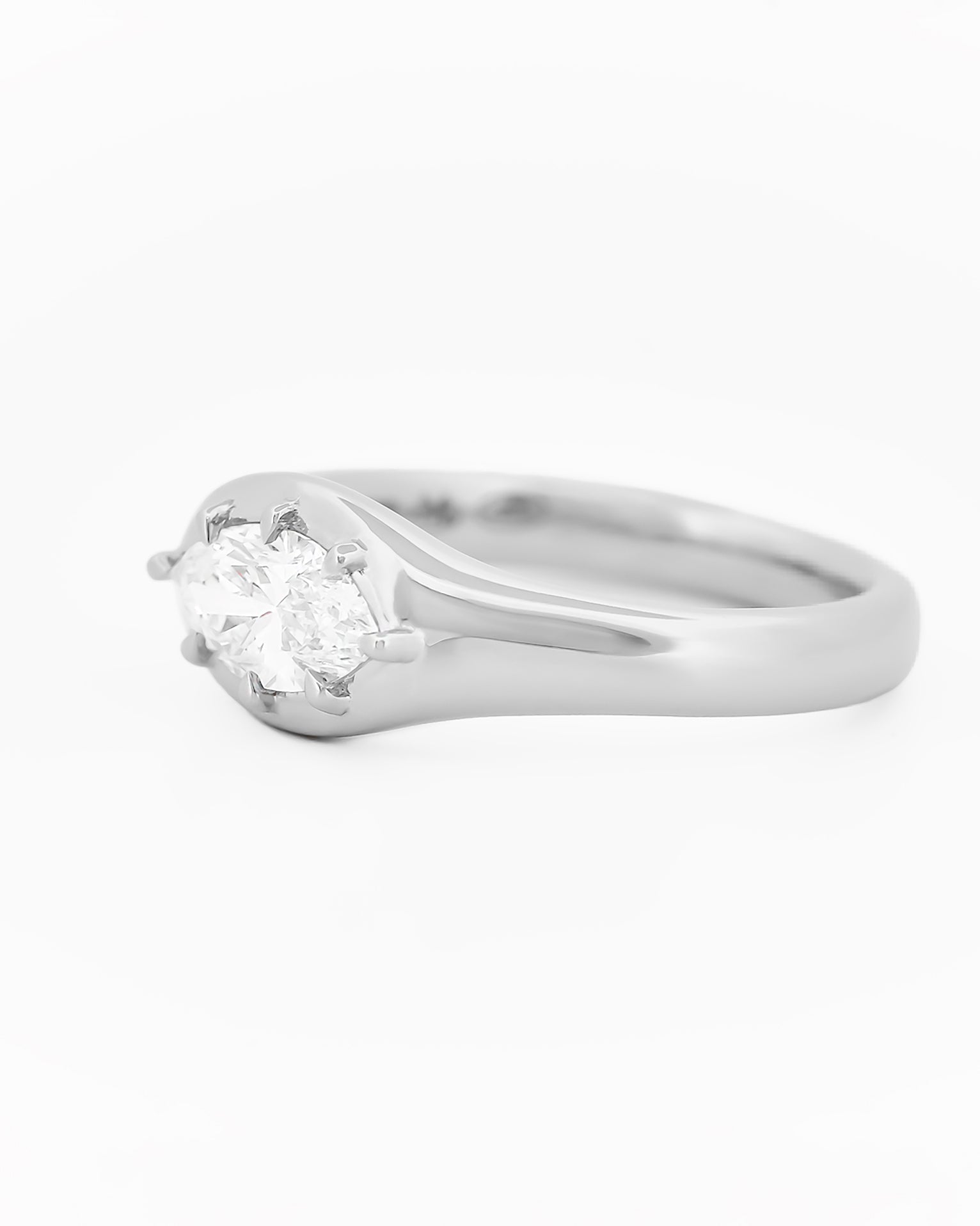 Signet Pinky Marquise Diamond ring, in white gold, on a with a white background