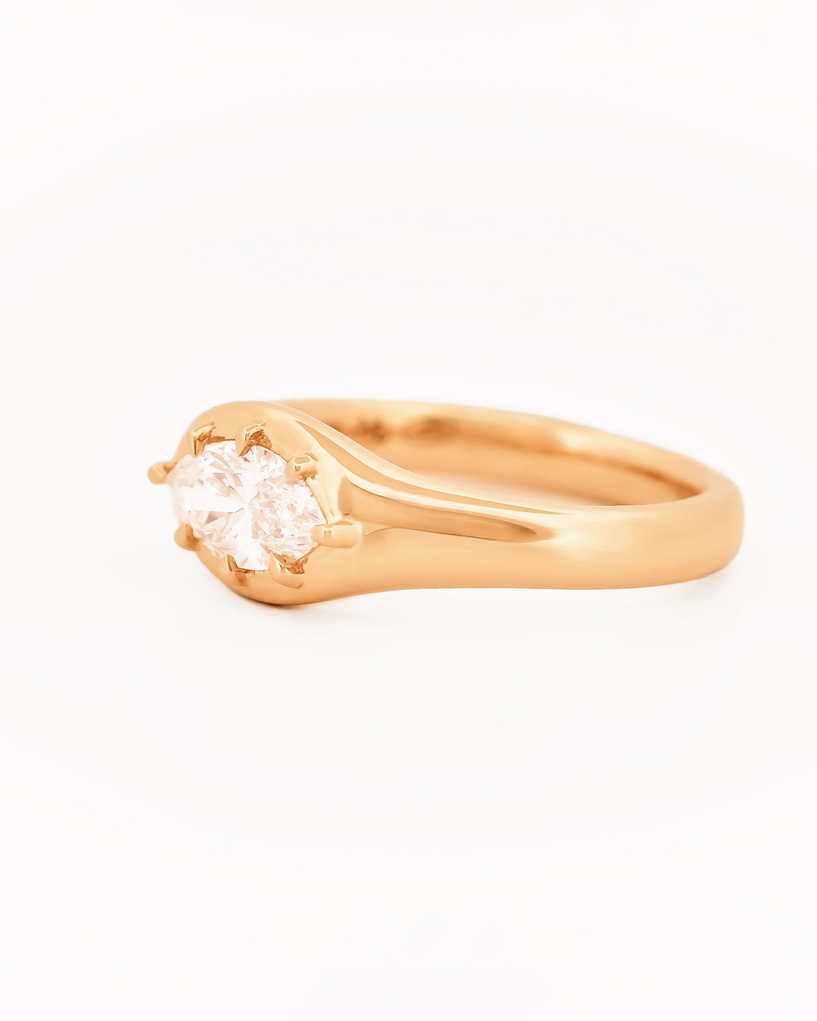 Signet Pinky Marquise Diamond ring, in yellow gold, on a with a white background