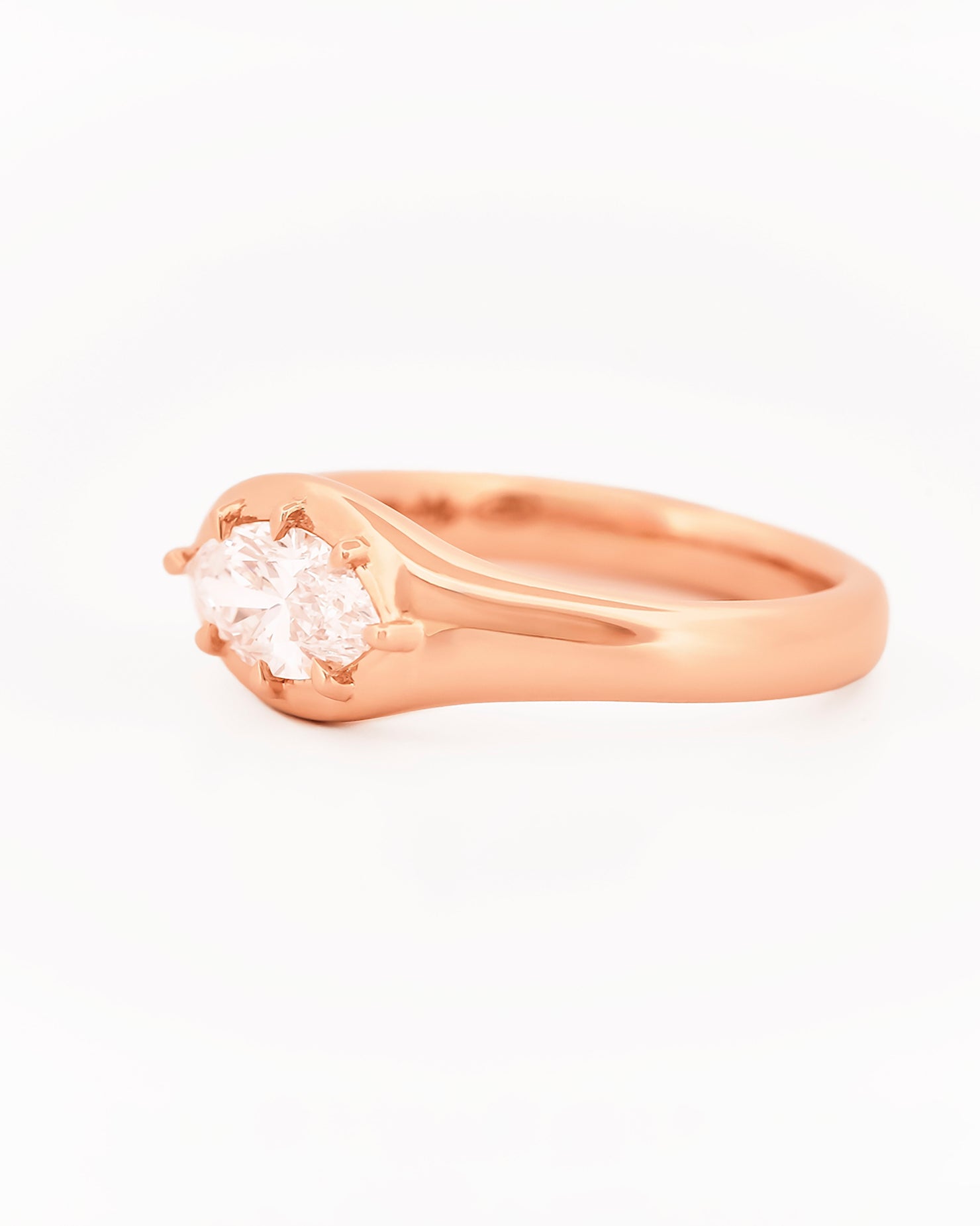 Signet Pinky Marquise Diamond ring, in rose gold, on a with a white background