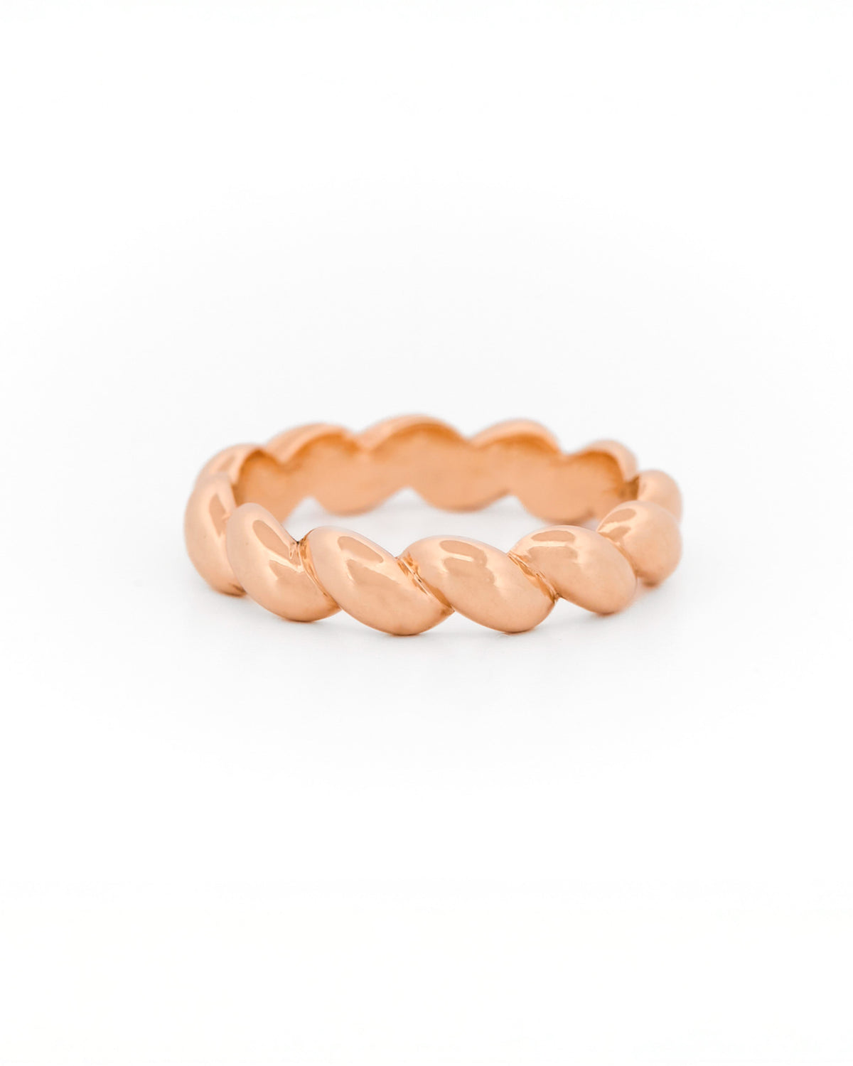 Rose Gold ring with a braided design on a white background