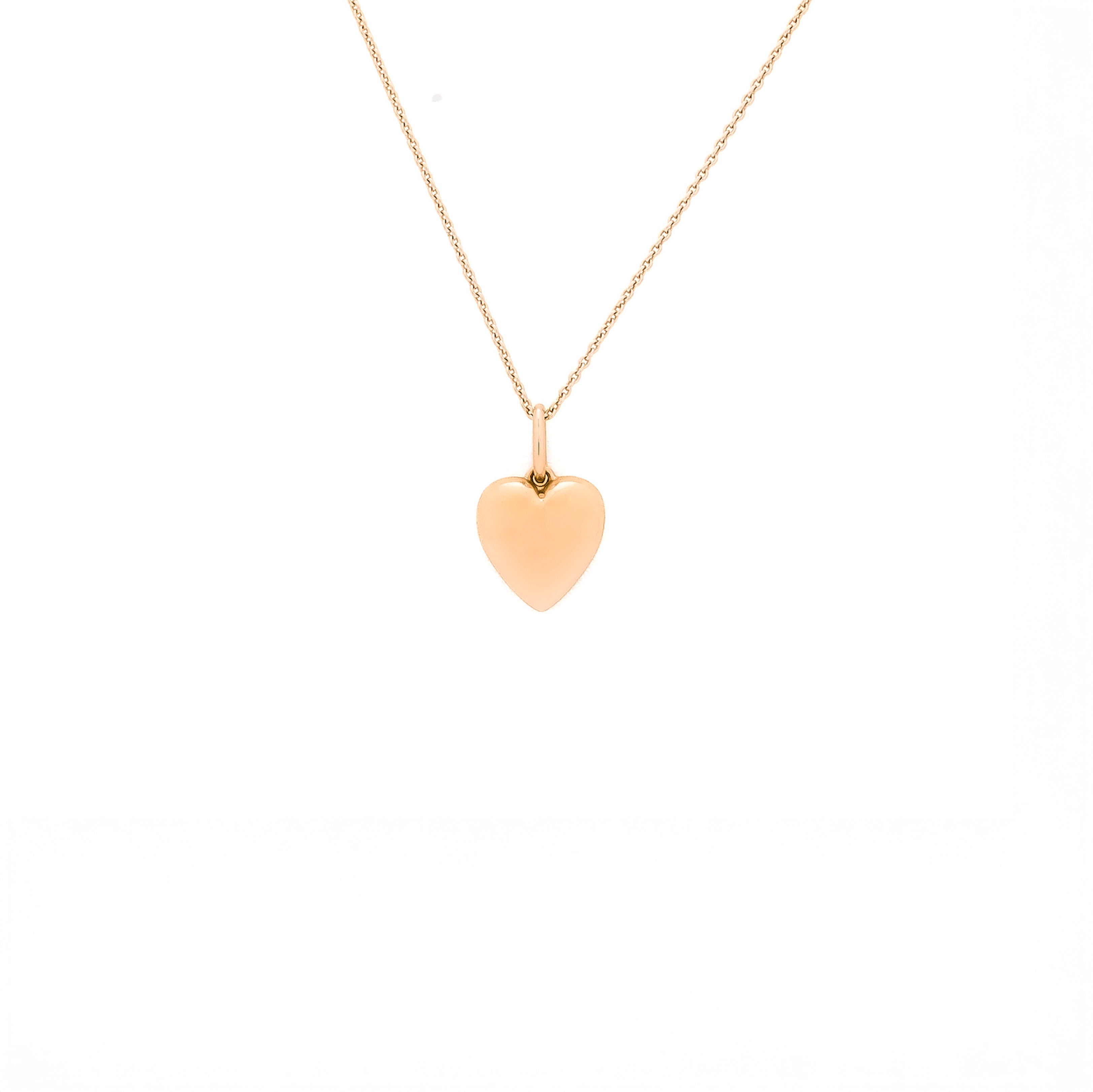 Gold heart-shaped pendant necklace on a white background
