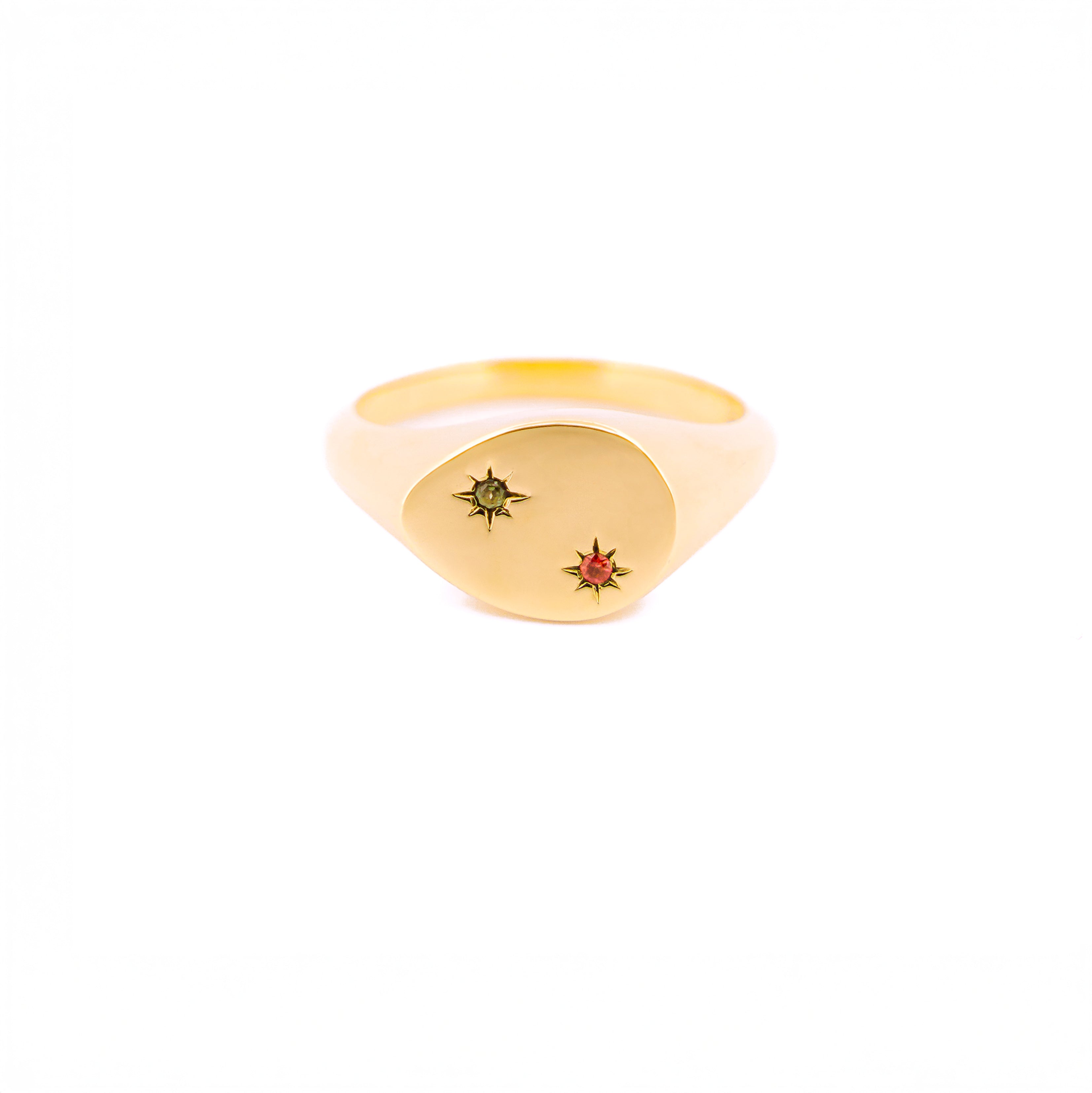 Gold ring with embedded gemstones on a white background, the stones are set inside 2 stars