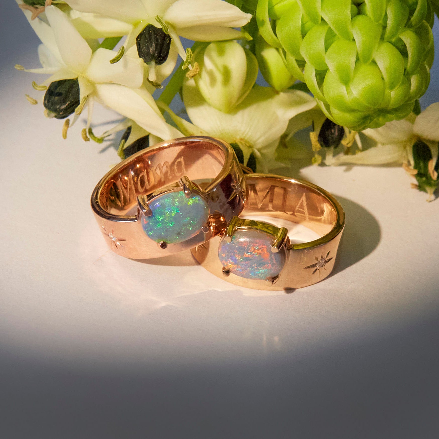 australian opal band ring in rose gold and yellow gold with visible engravings