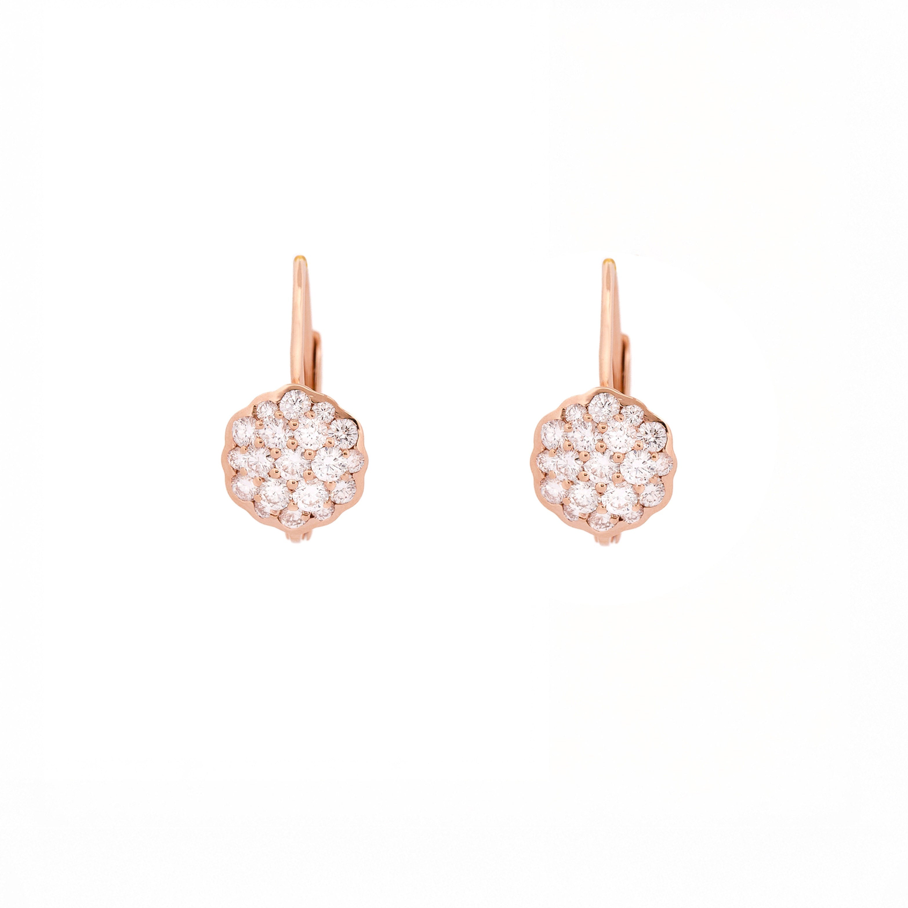 Pair of rose gold earrings with a flower made of diamonds on a white background