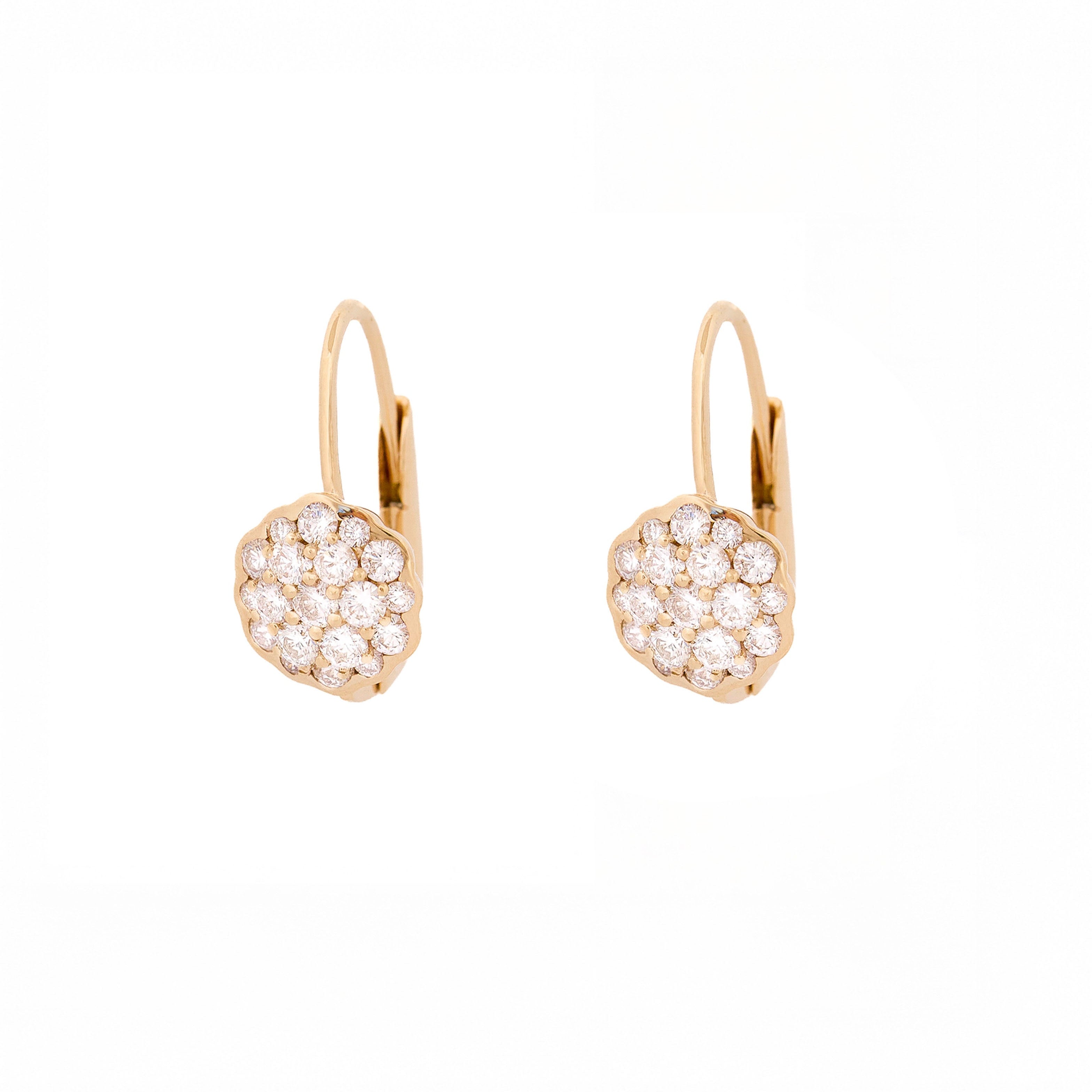 Pair of yellow gold earrings with a flower made of diamonds on a white background
