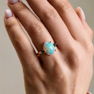 Vintage looking Ethiopian Opal ring with blue sapphire side stones on hand. Inel vintage cu opal etiopian și safire albastre pe mana.
