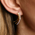 Petal Earrings in bi color gold and white diamonds on model. Cercei Petals din aur bi color si diamante albe pe model. 